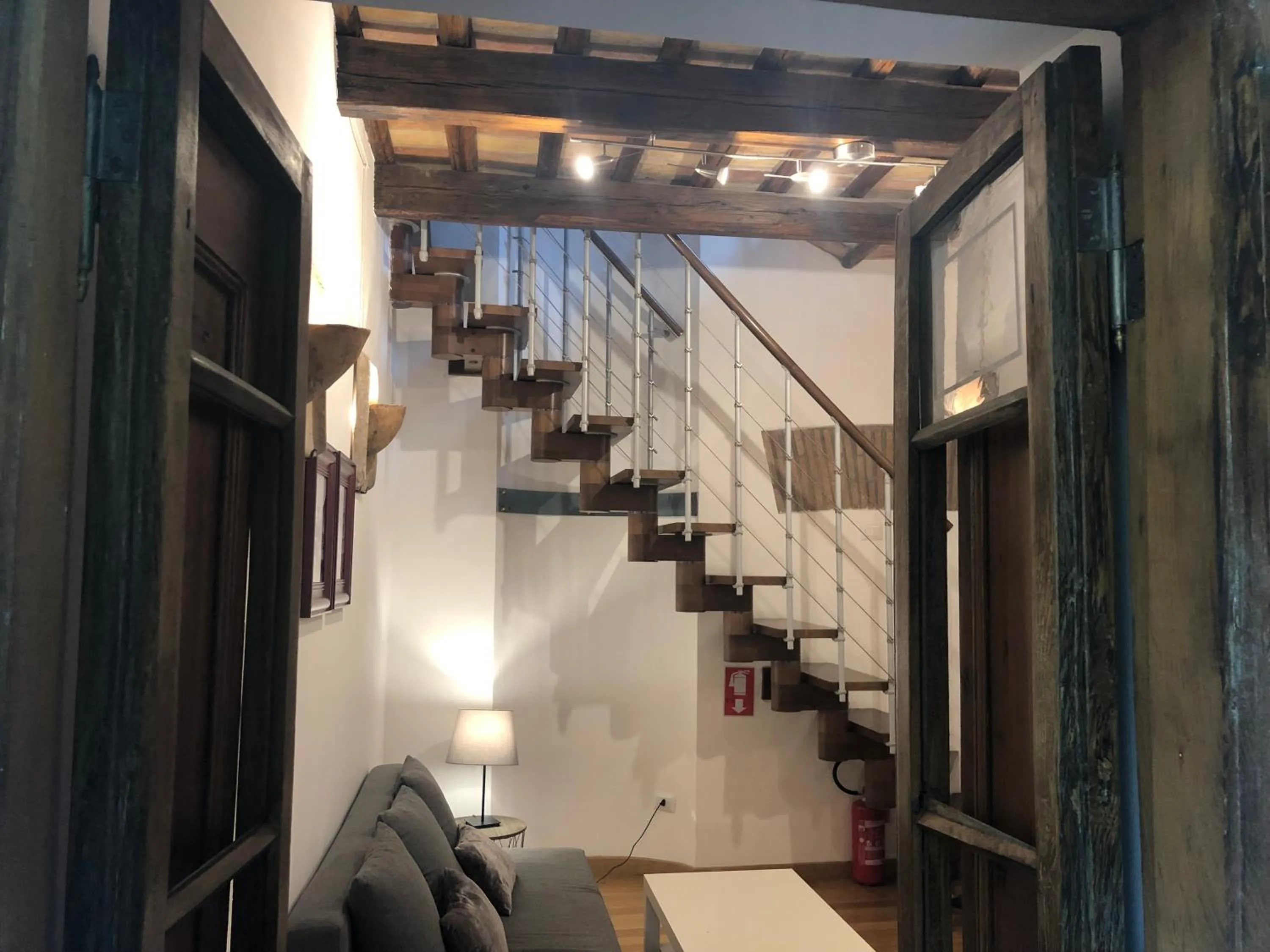 Communal lounge/ TV room in Giuturna Boutique Hotel