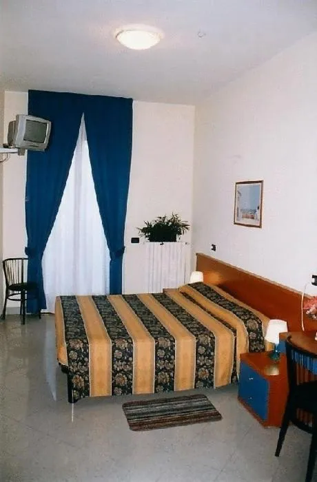 Bed in Hotel Greco