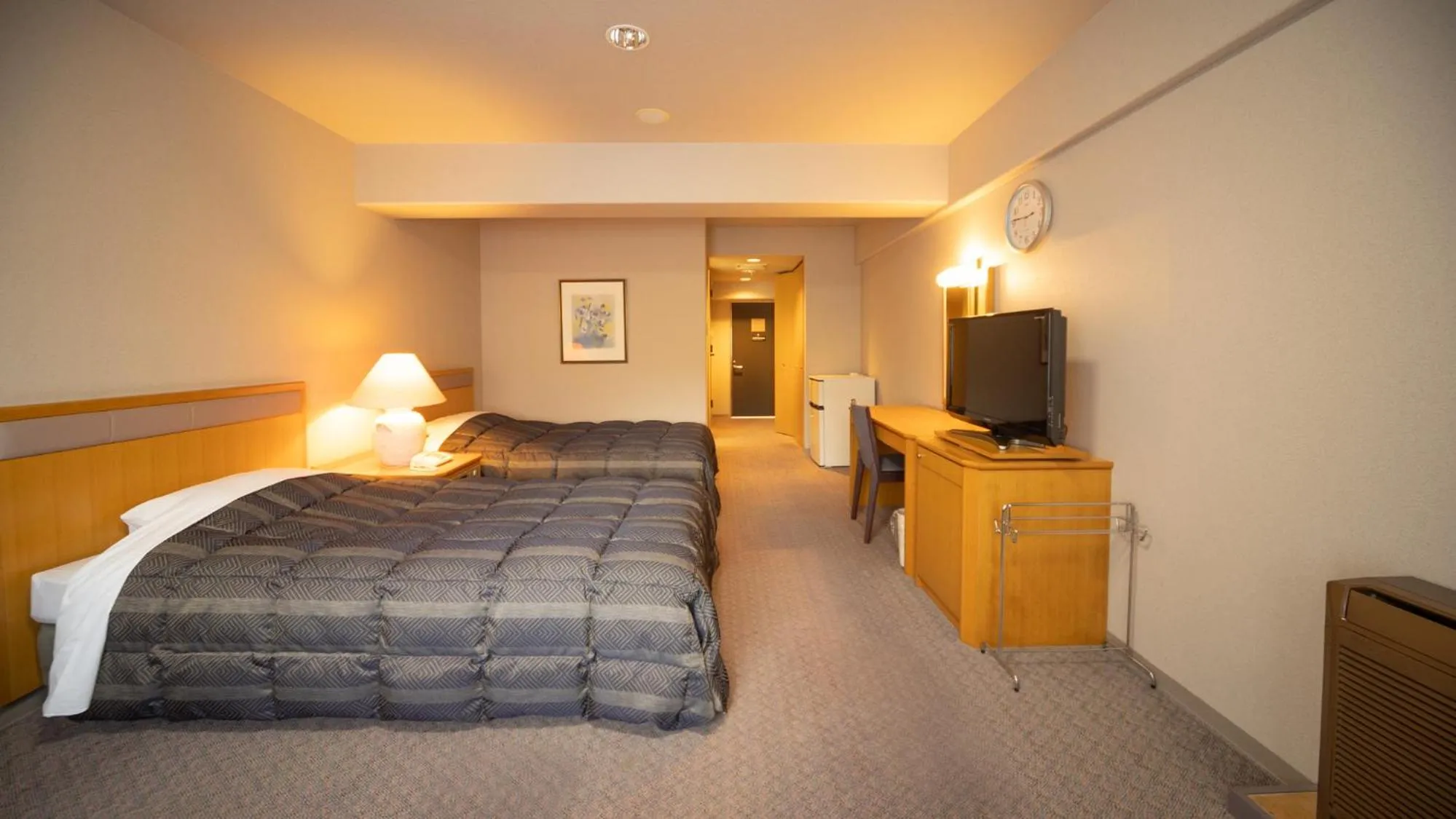 Bed in Hyper Resort Villa Shionoe