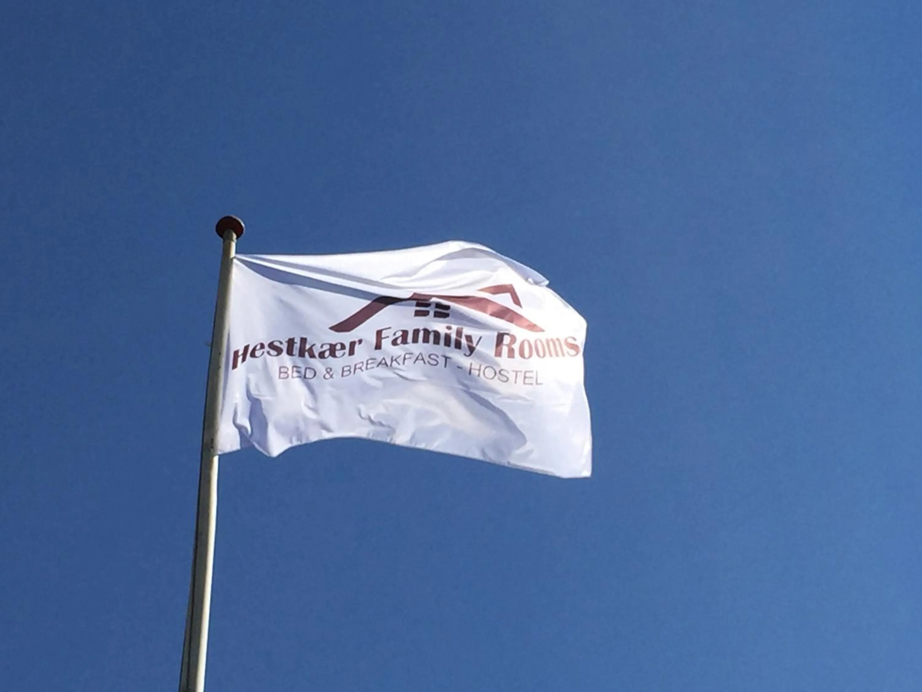 Property logo or sign in Hestkær Family Rooms