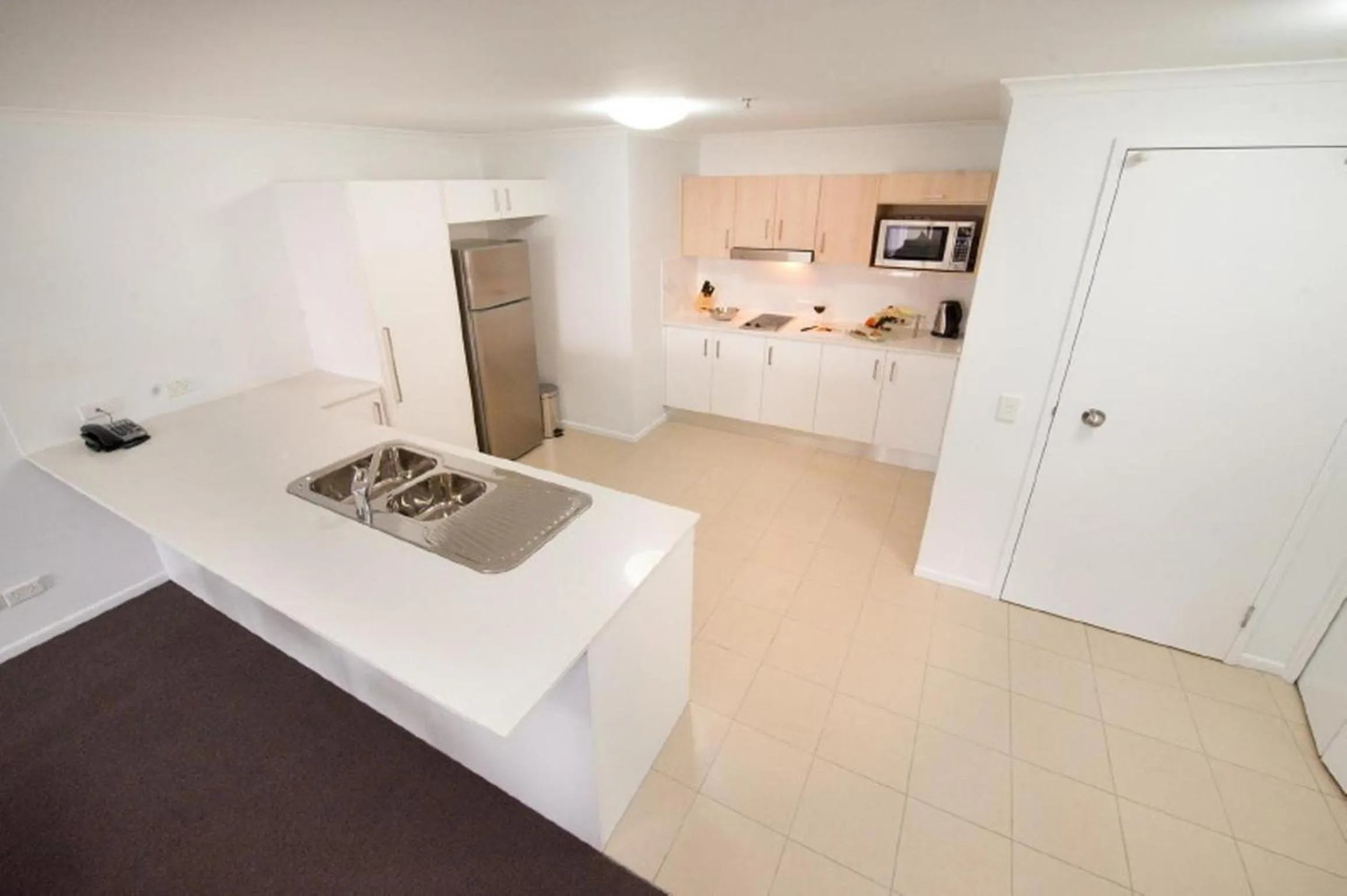 Kitchen or kitchenette in Edge Apartment Hotel