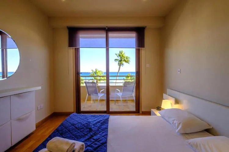 Bed in Les Palmiers Beach Boutique Hotel & Luxury Apartments