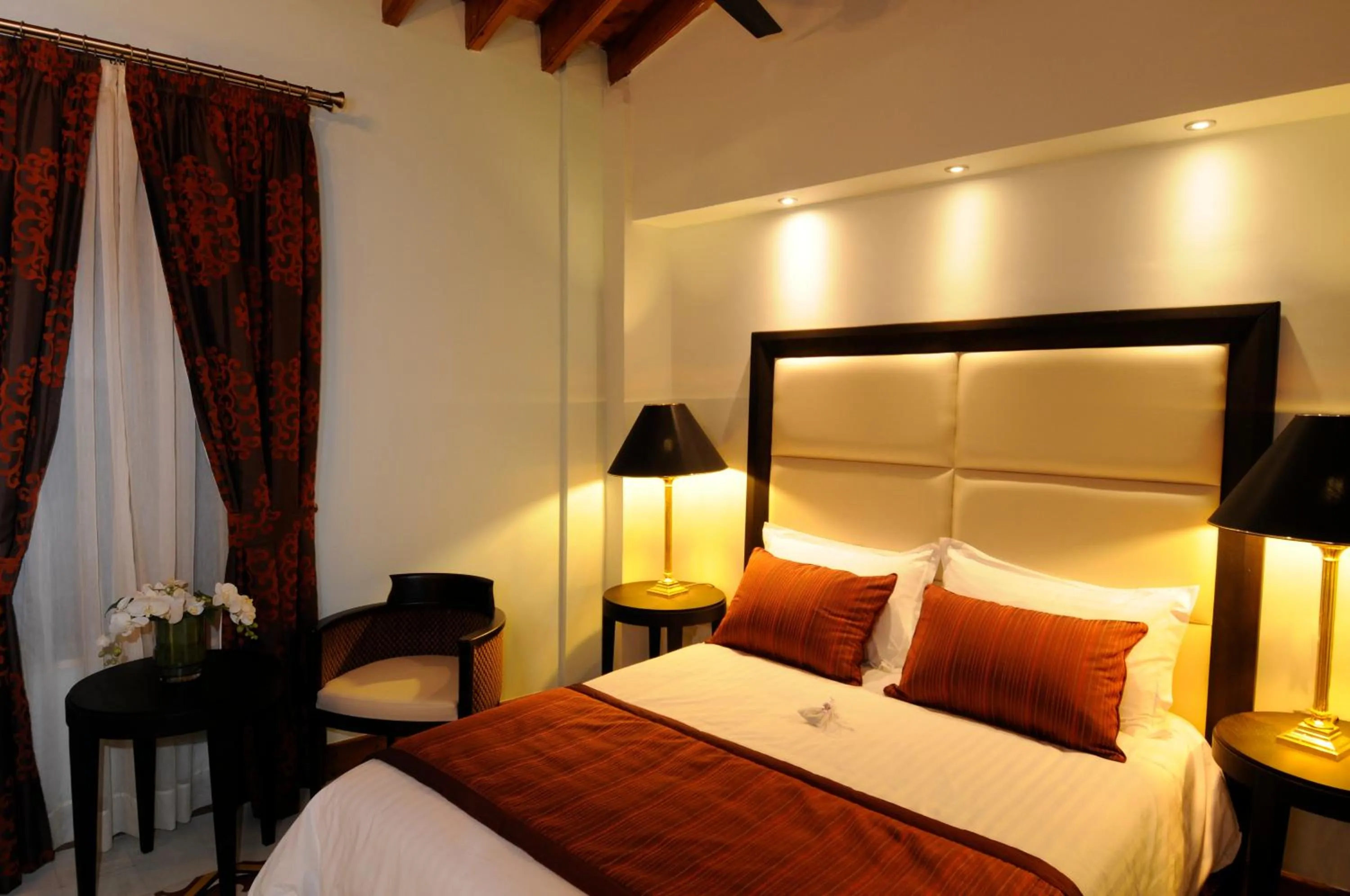 Bed in The Library Hotel Wellness Retreat