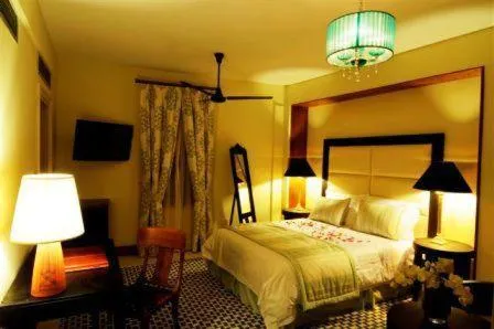 Bed in The Library Hotel Wellness Retreat