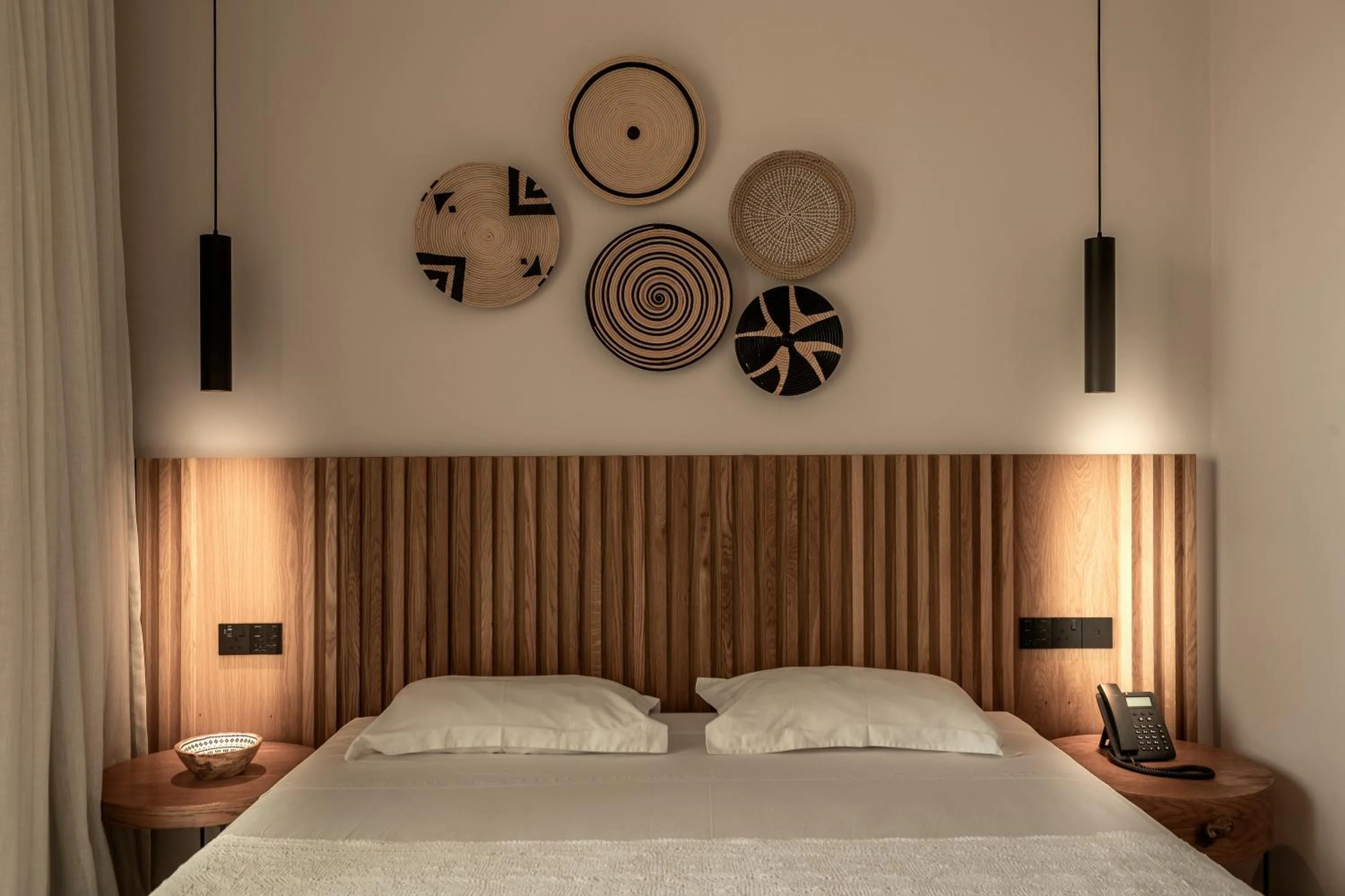 Bed in Anemi Hotel & Suites