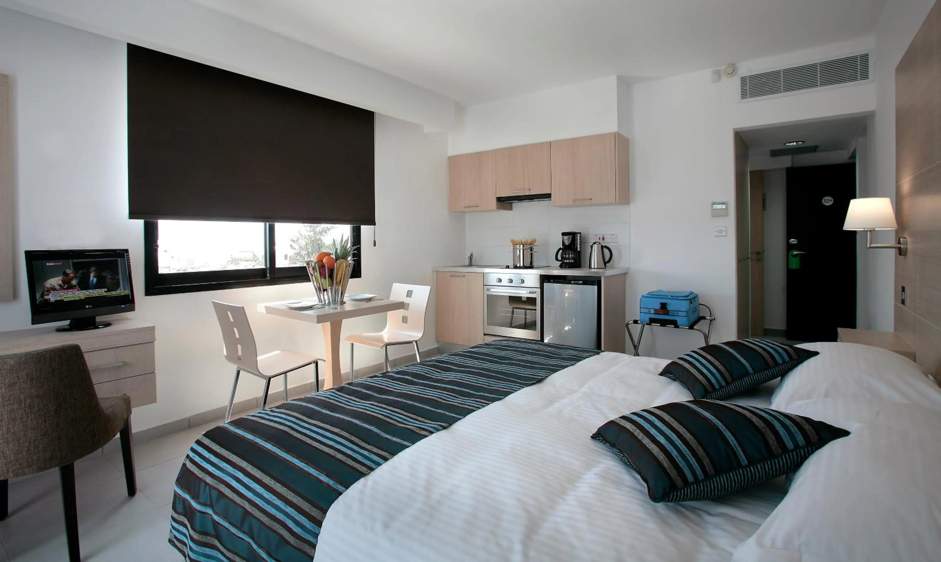 Bed in Anemi Hotel & Suites