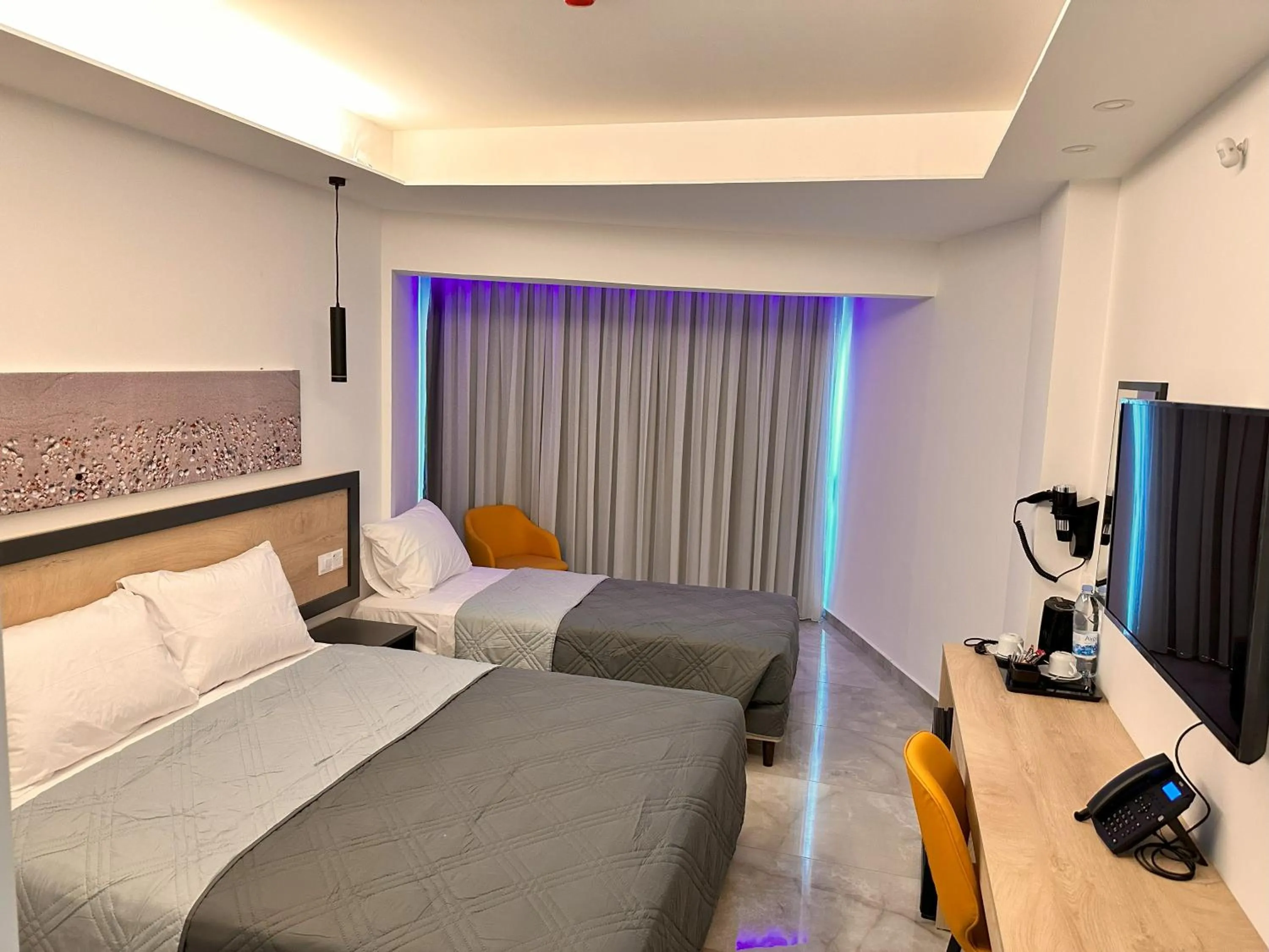 Bed in Papouis Protaras Hotel