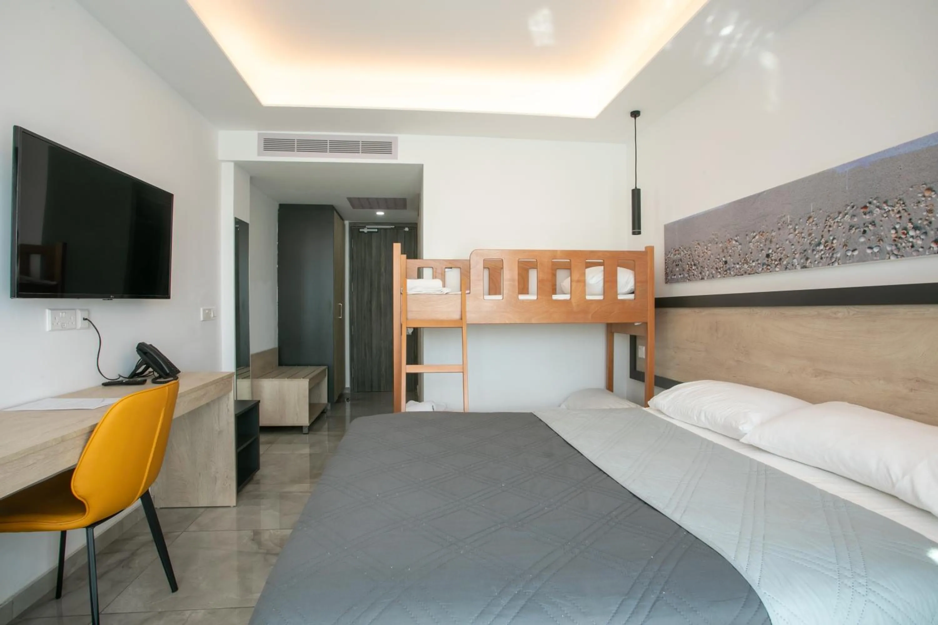 Bed in Papouis Protaras Hotel