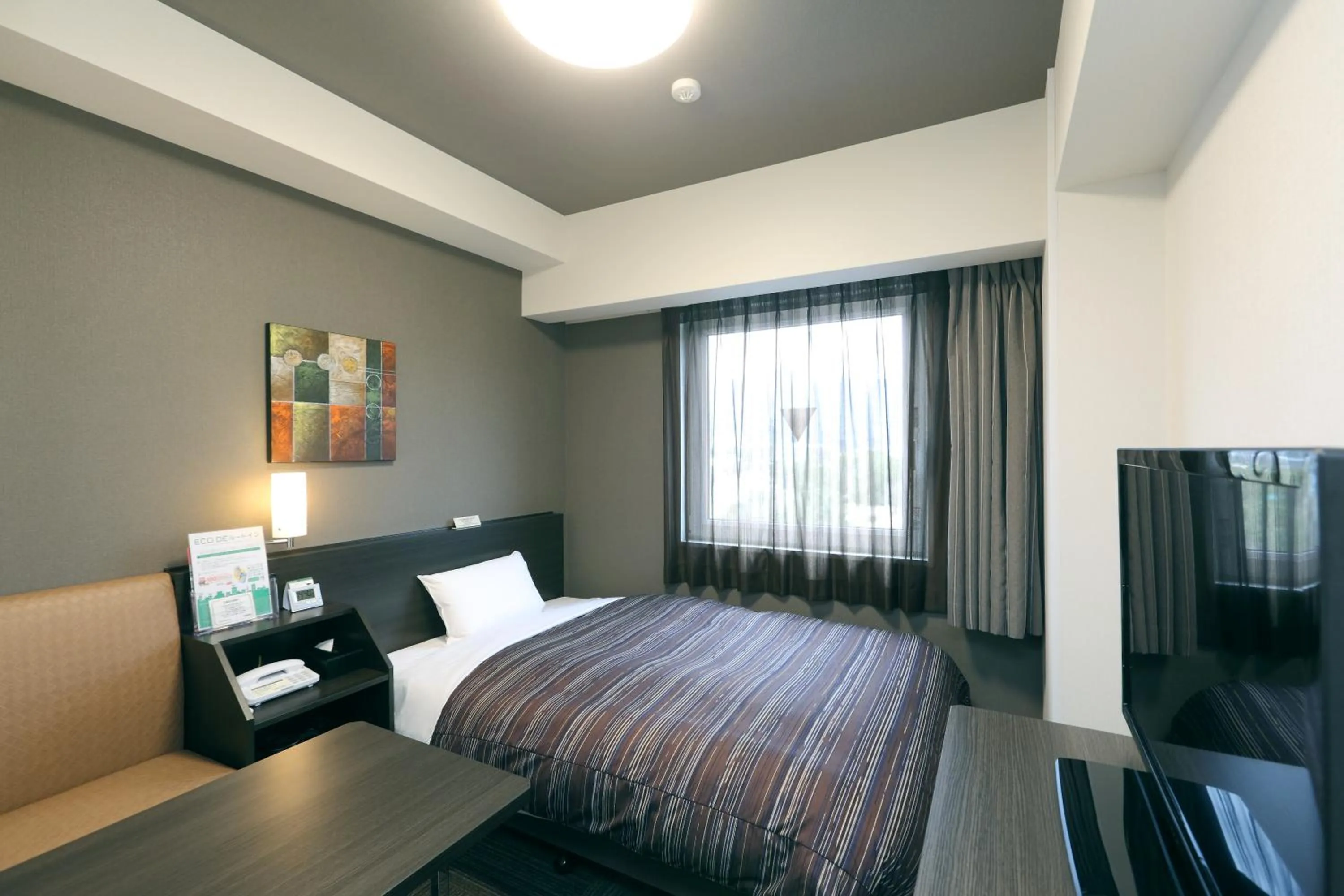 Bed in Hotel Route-Inn Shimizu Inter