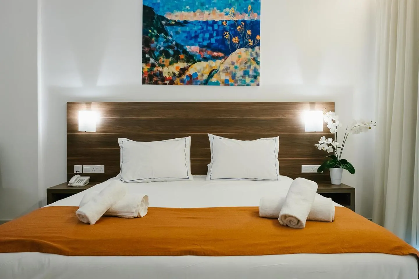 Bed in Theo Sunset Bay Hotel