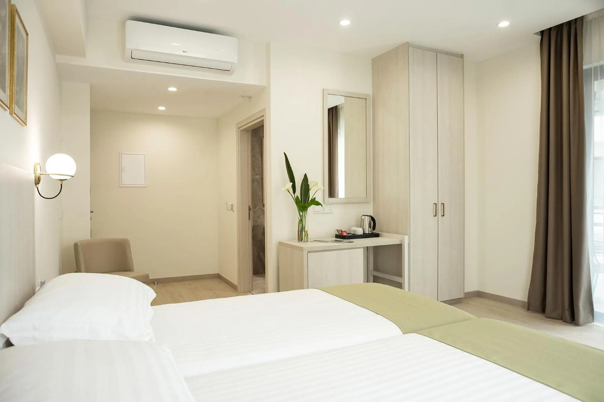 Bed in Roseum Boutique Hotel