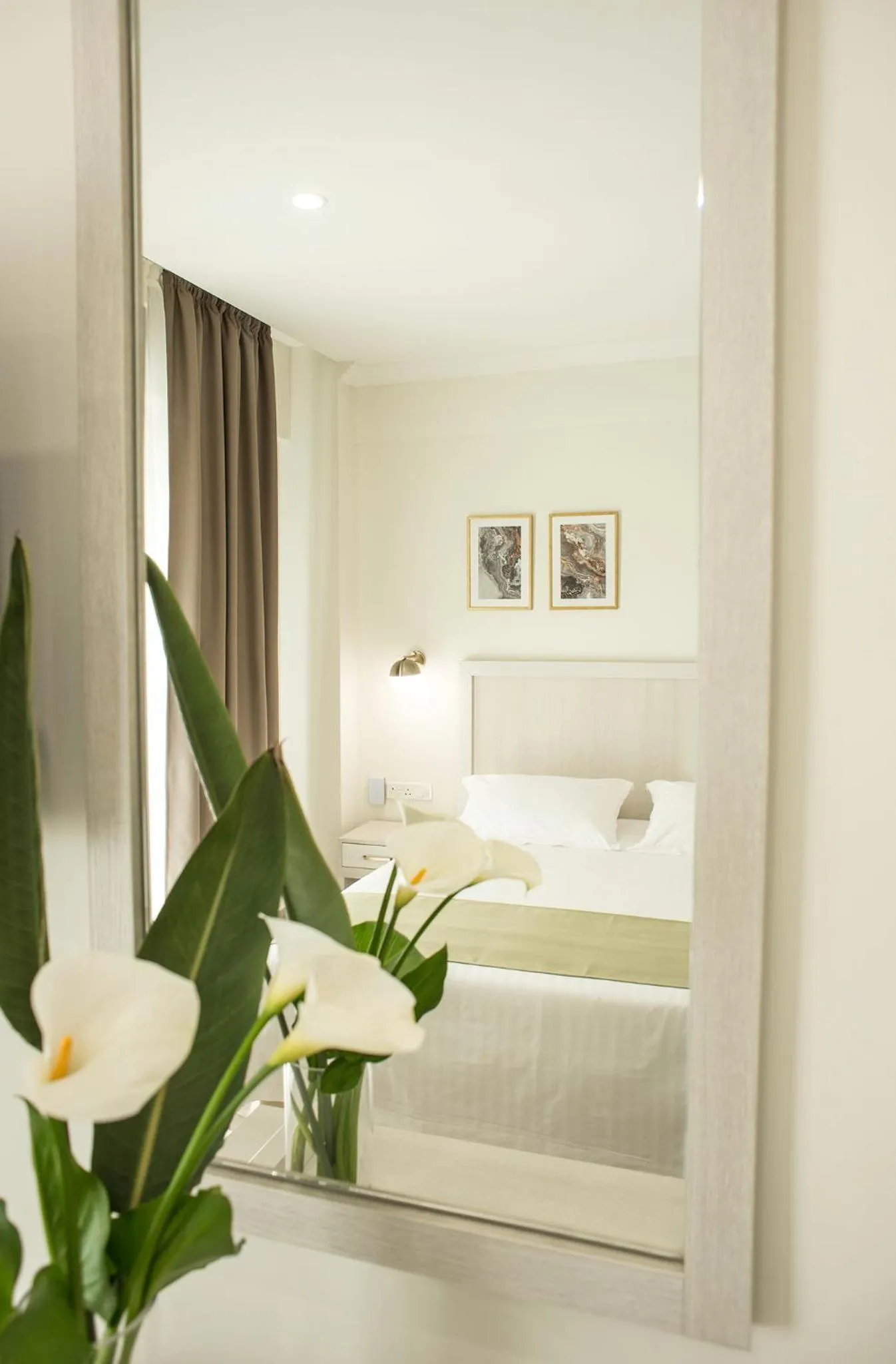 Bed in Roseum Boutique Hotel