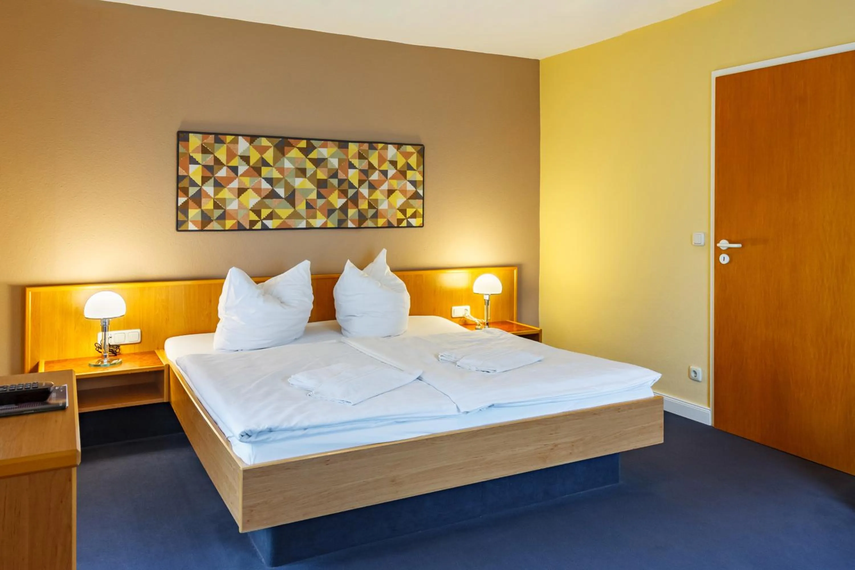 Photo of the whole room, Bed in City-Pension Dessau-Roßlau