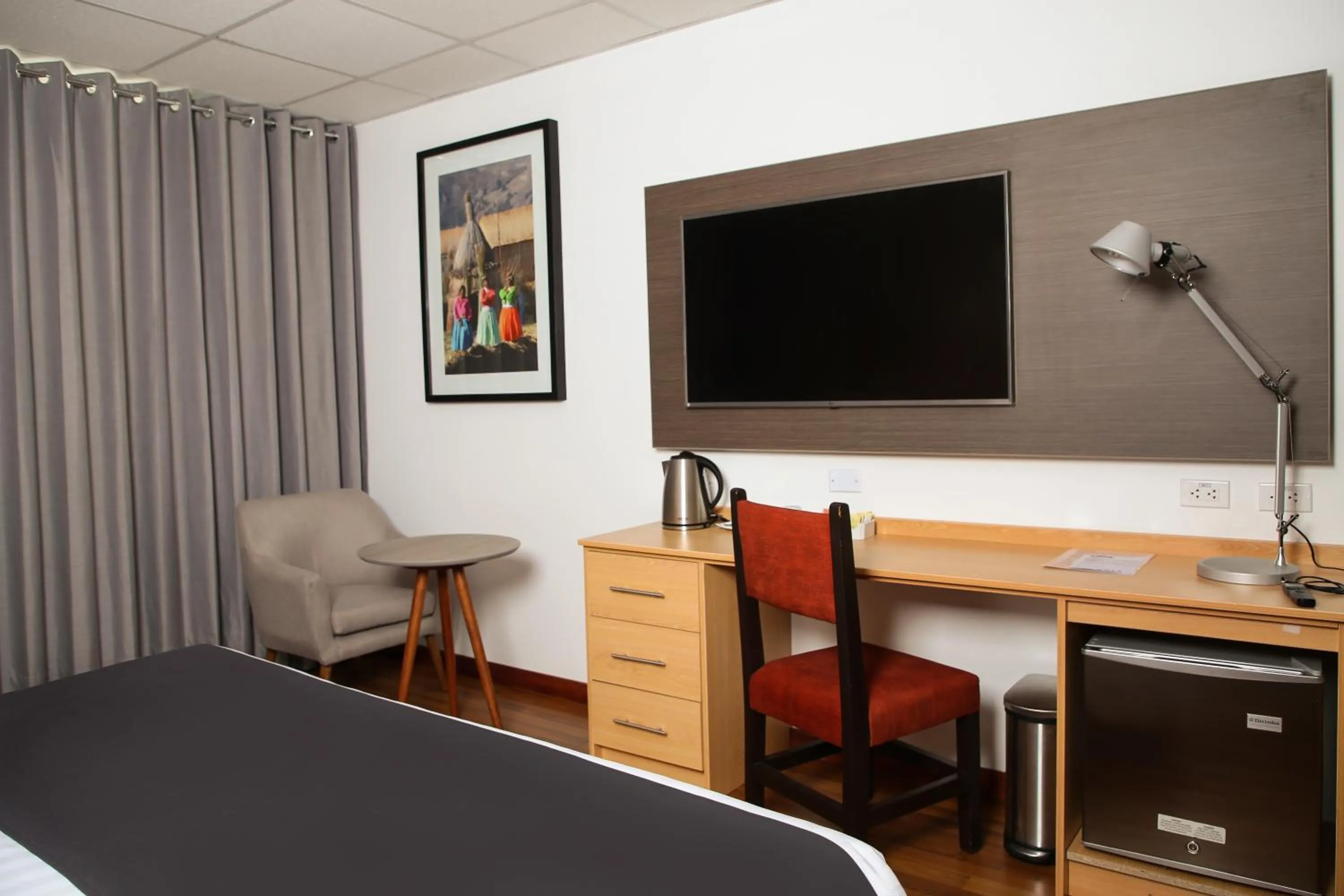 Bedroom, TV/Entertainment Center in Xima Exclusive Puno