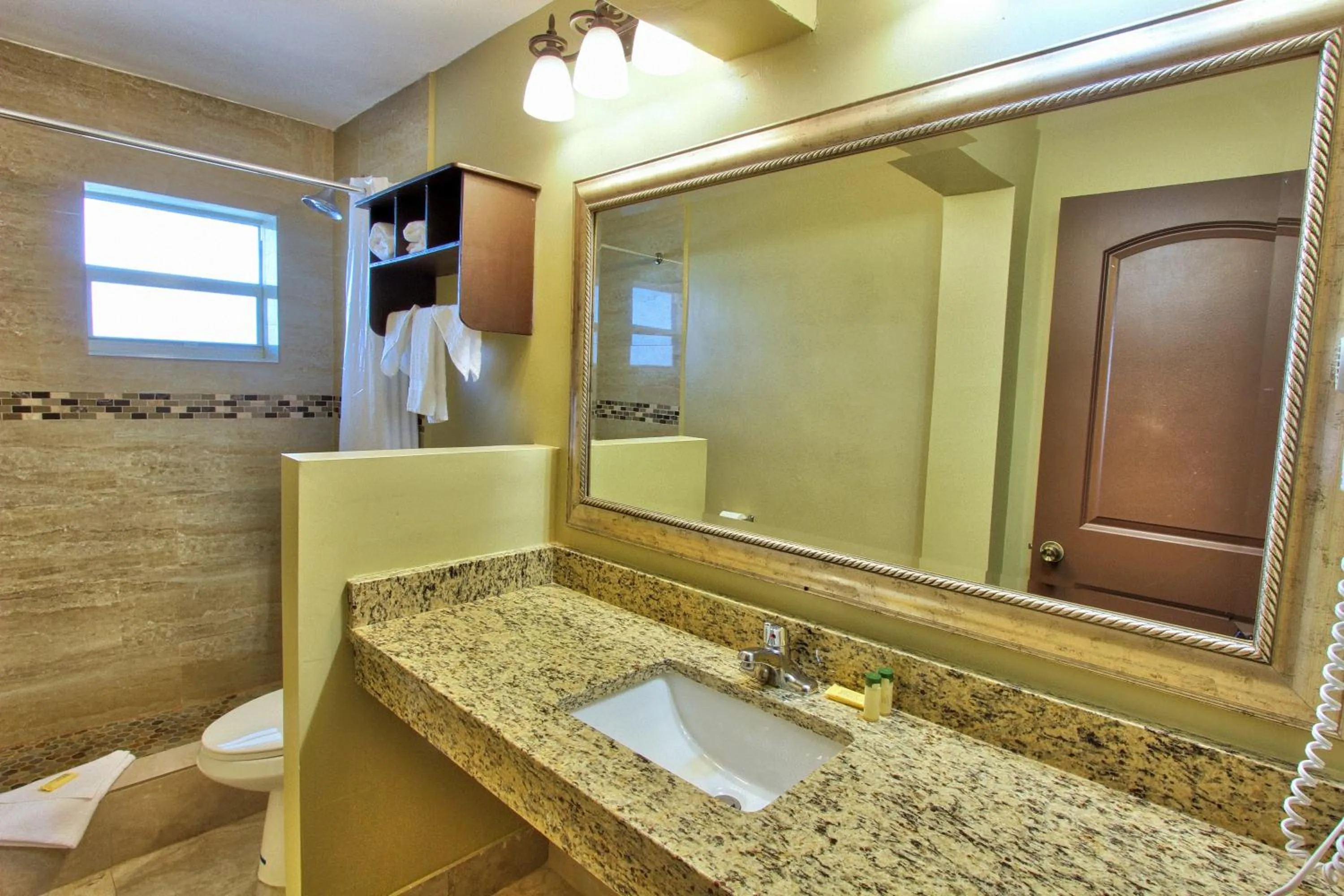 Bathroom in Oceans Beach Resort & Suites