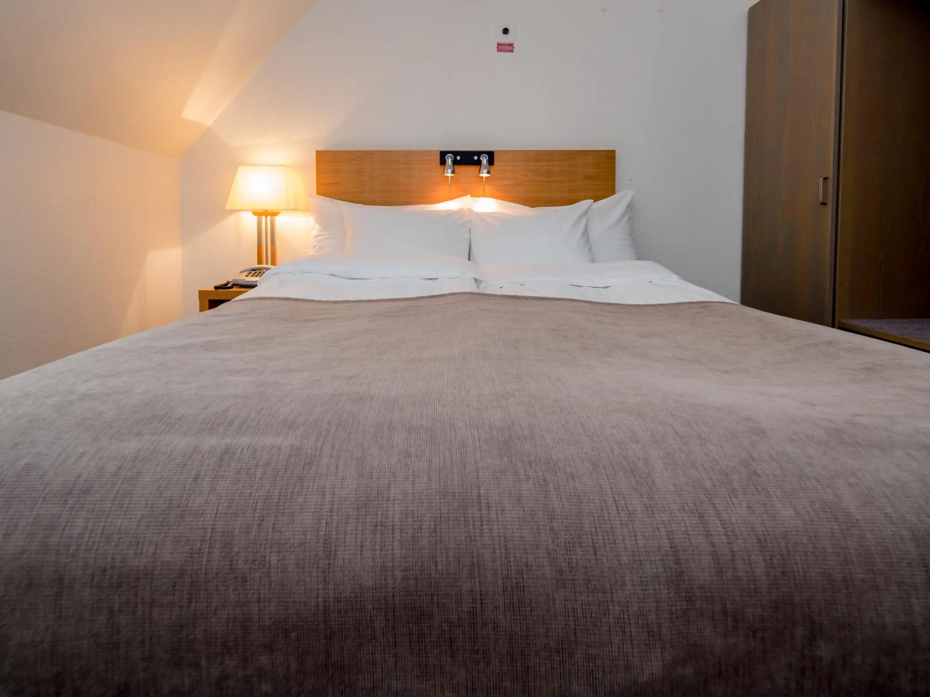 Photo of the whole room, Bed in Grand Hotel Falkenberg