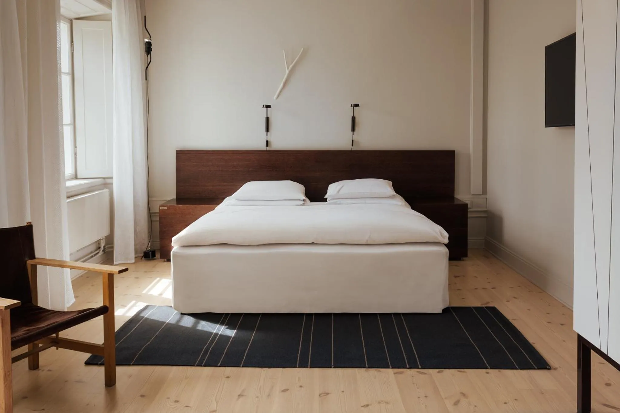 Bed in Hotel Skeppsholmen, Stockholm, a Member of Design Hotels