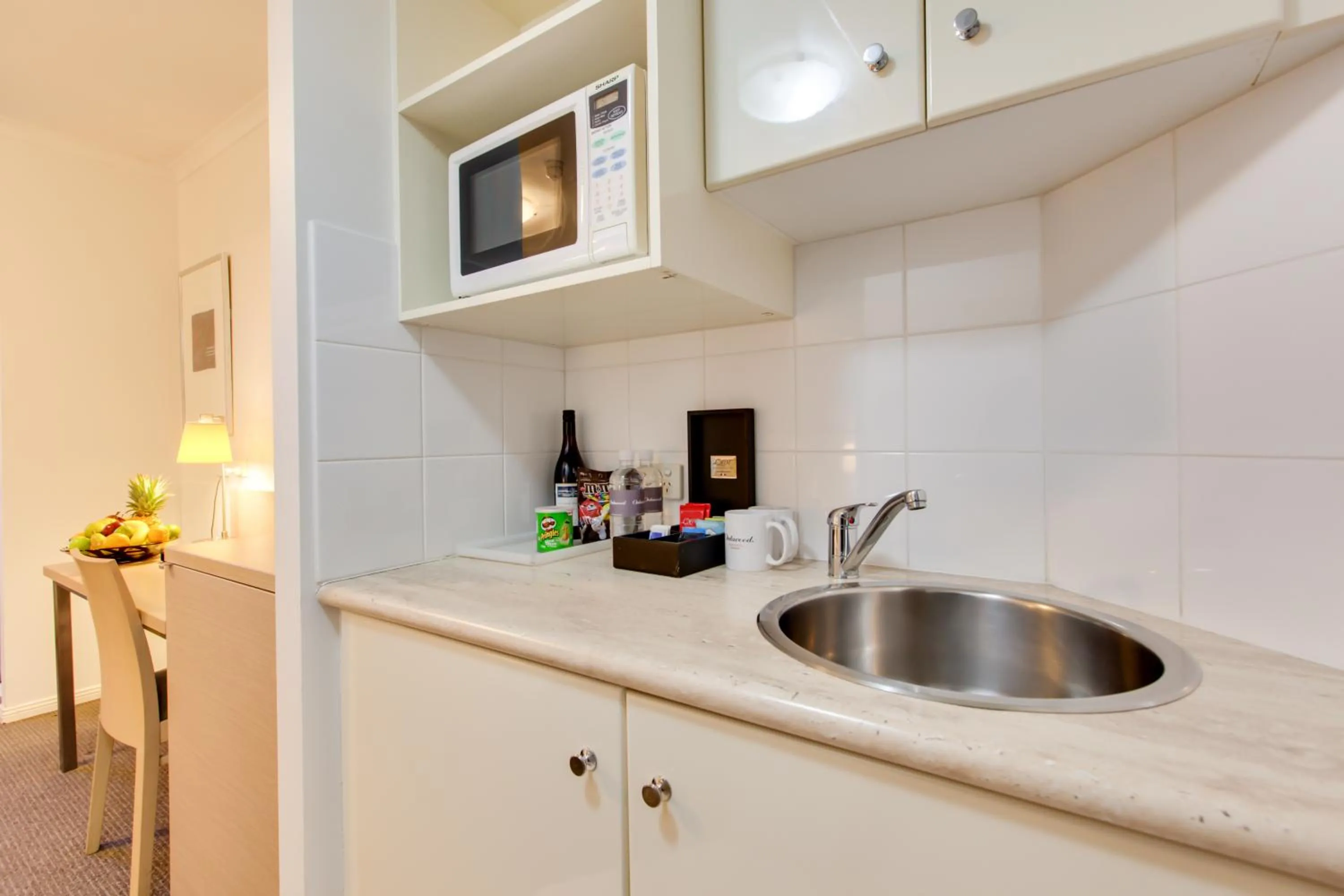 Kitchen or kitchenette, Kitchen/Kitchenette in Oakwood Hotel & Apartments Brisbane