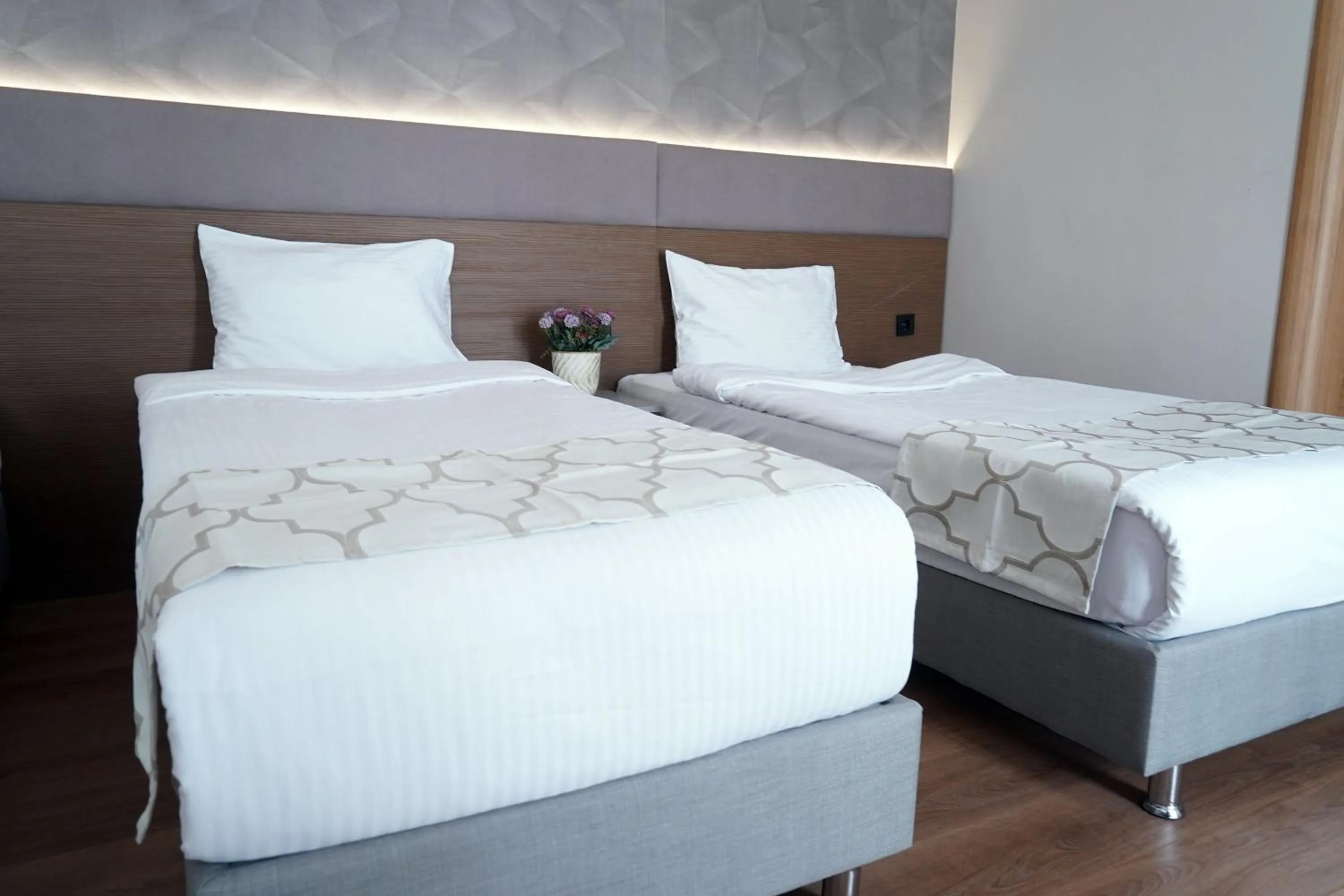 Bed in Niconya Port Suite&Hotel