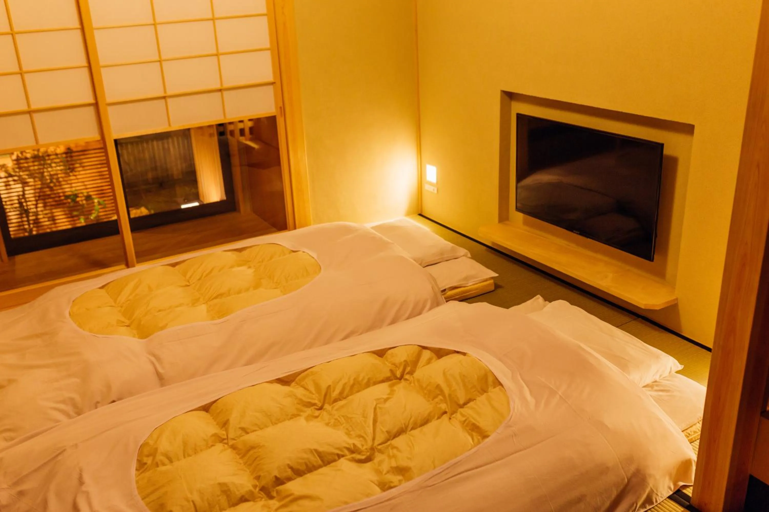 Bed in Kyomachiya Suite Rikyu