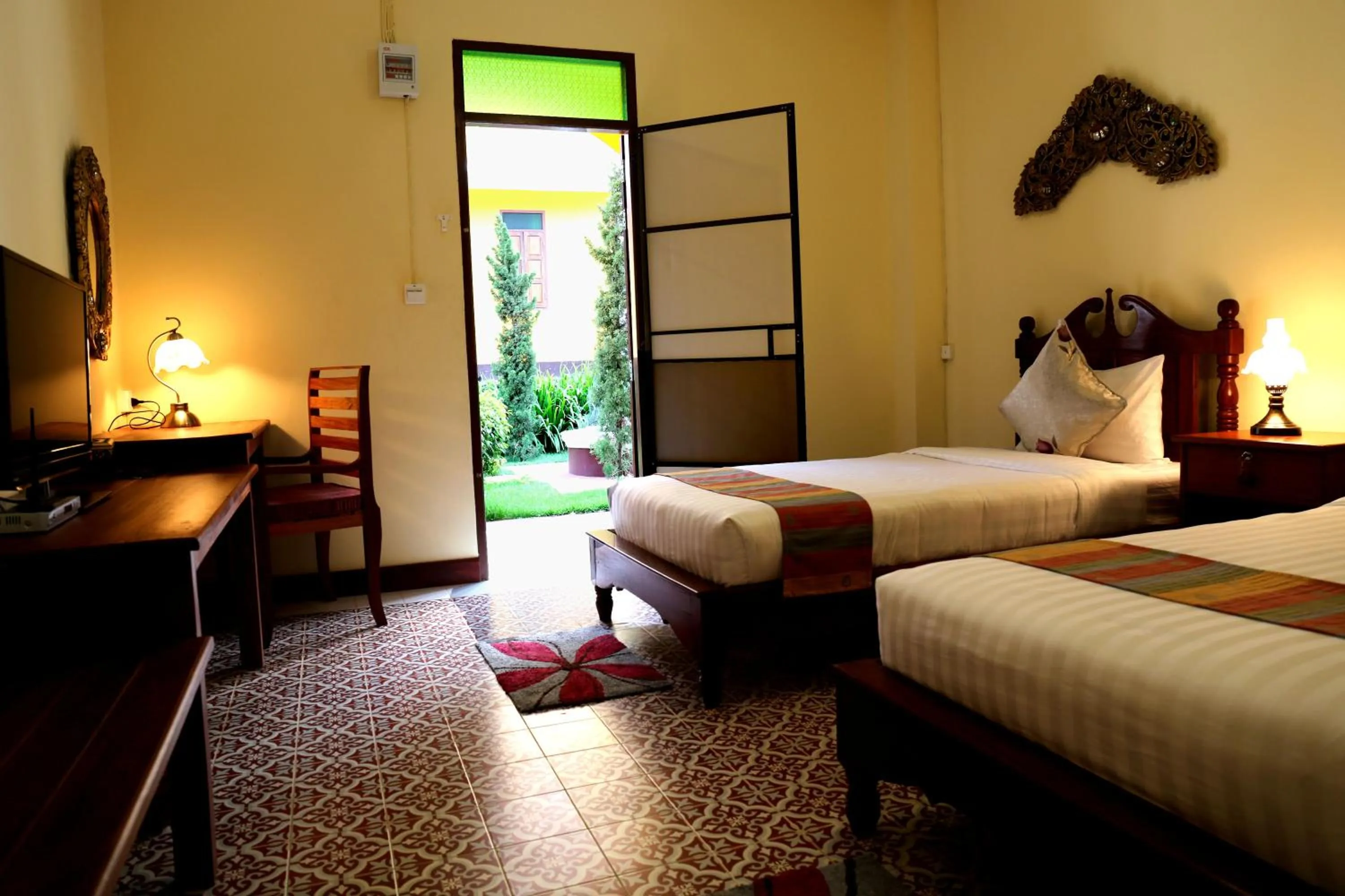 Bed in Le Jardin Hotel