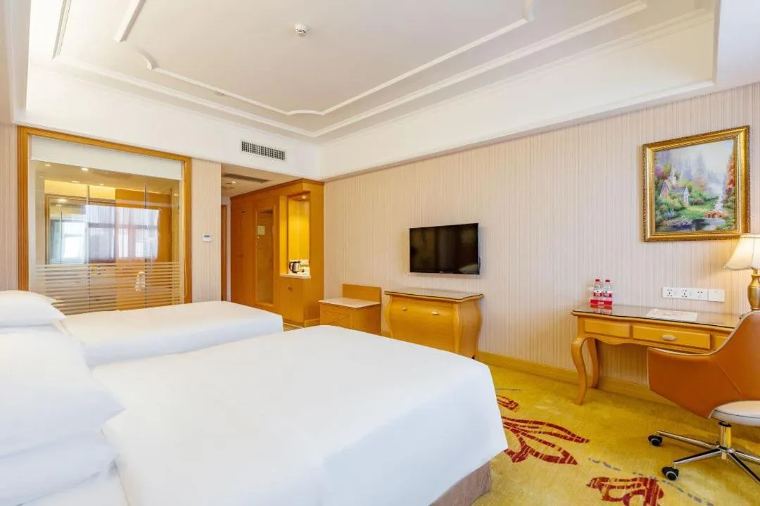 Bed in Vienna Hotel Shenzhen Guangming Guangqiao Road Tianliao