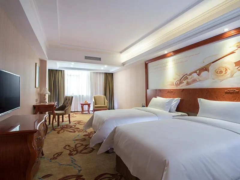 Bed in Vienna Hotel Longchuan