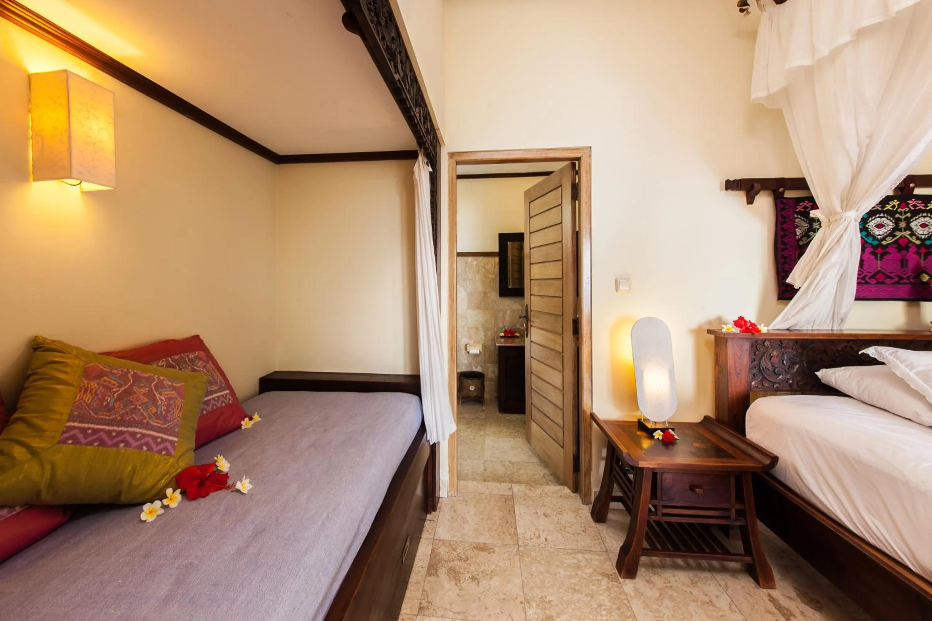 Seating area, Bed in Blue Moon Villas Resort