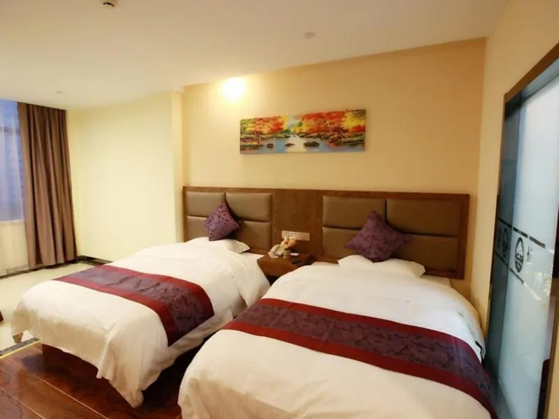 Bed in GreenTree Inn JiangSu NanTong HaiMen Shanghe Plaza Express Hotel