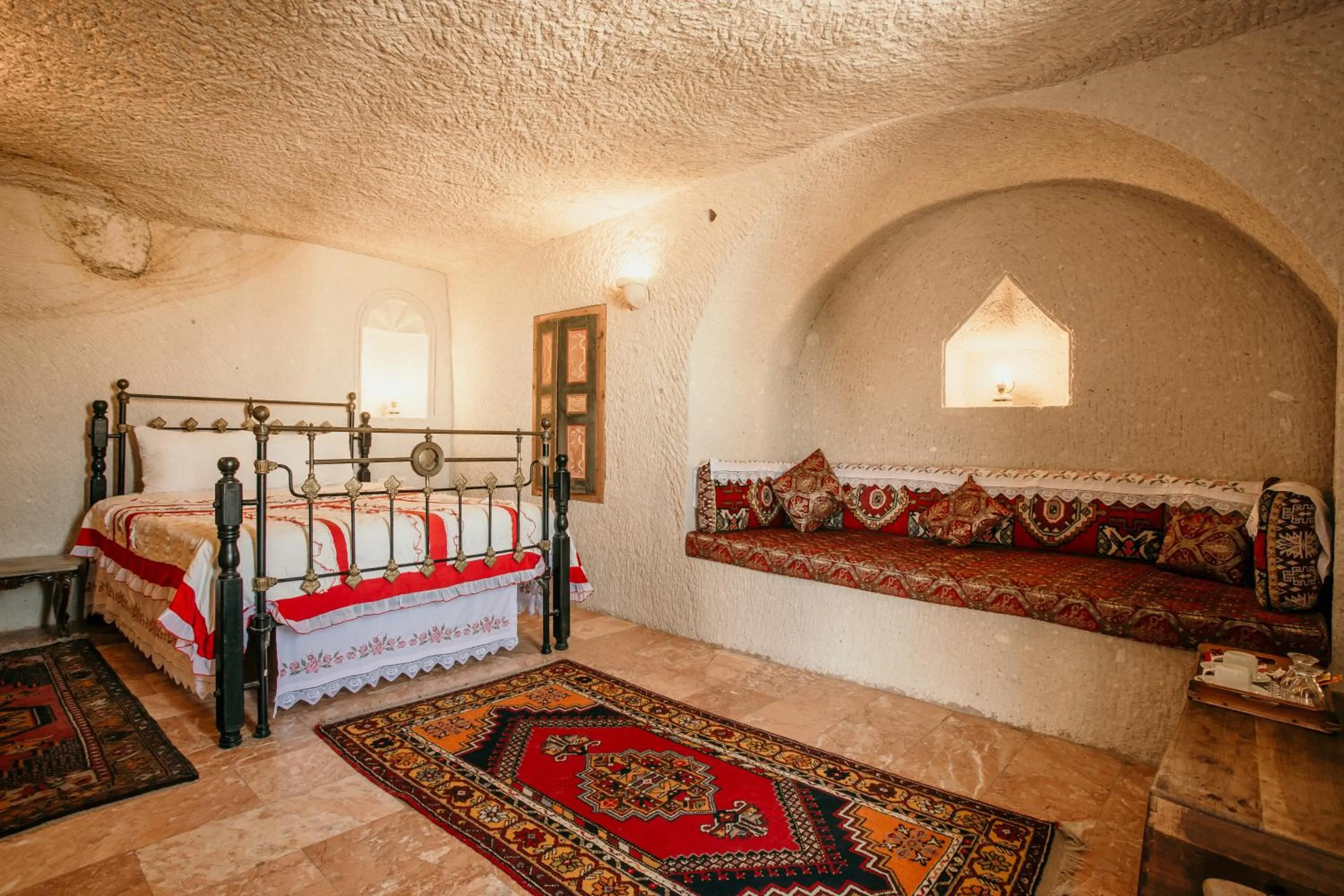 Bed in Village Cave House Hotel