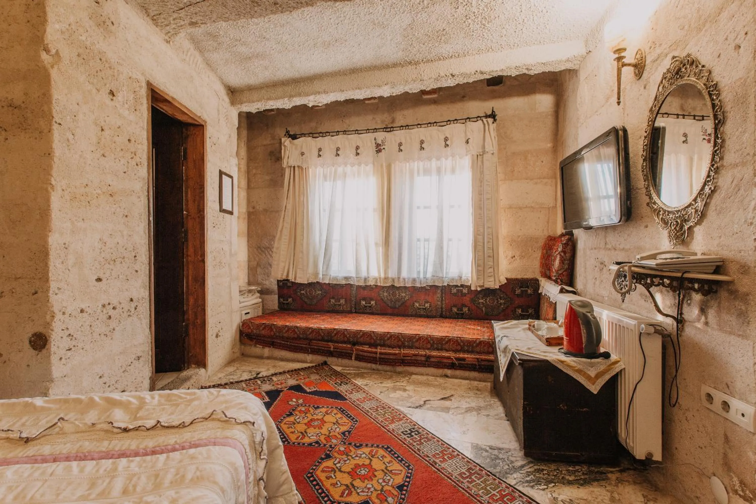 Bed in Village Cave House Hotel