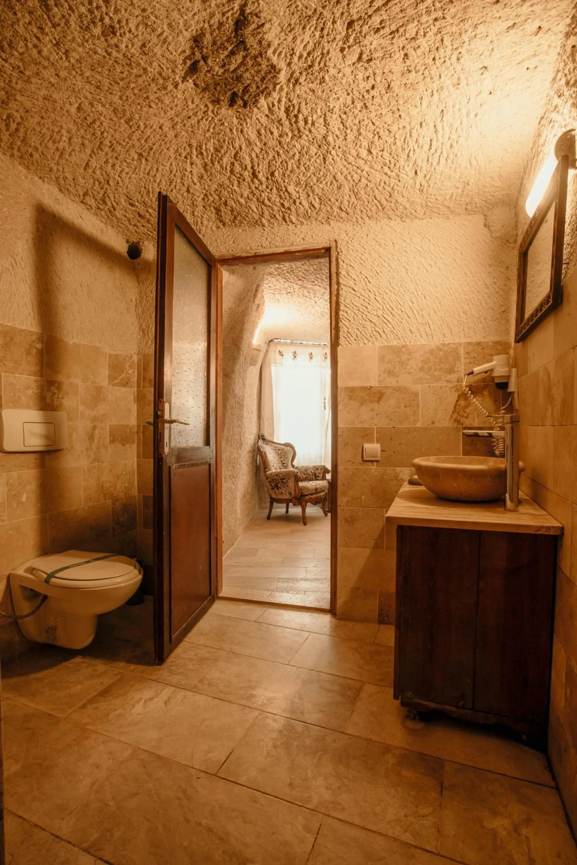 Toilet in Village Cave House Hotel