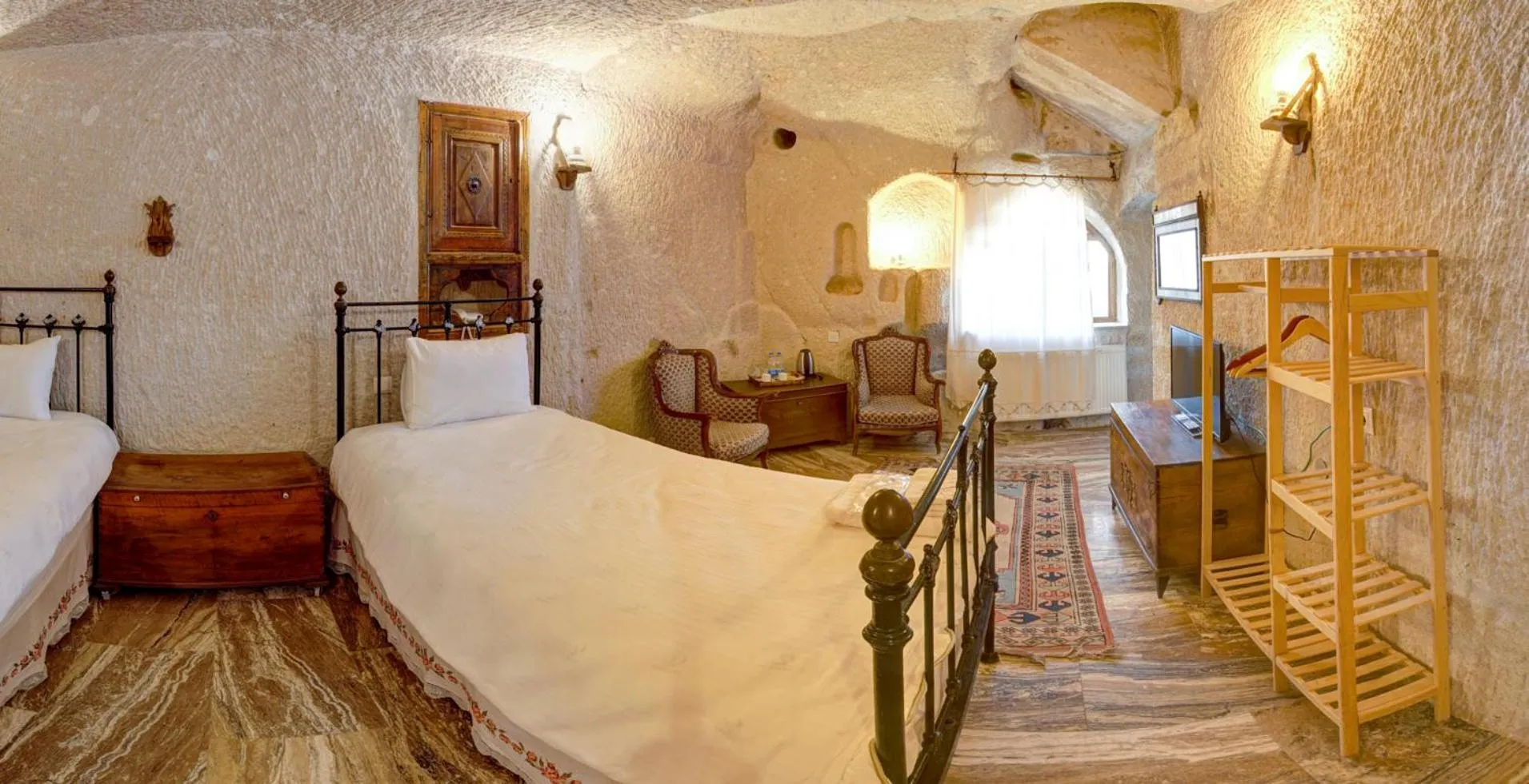 Bed in Village Cave House Hotel