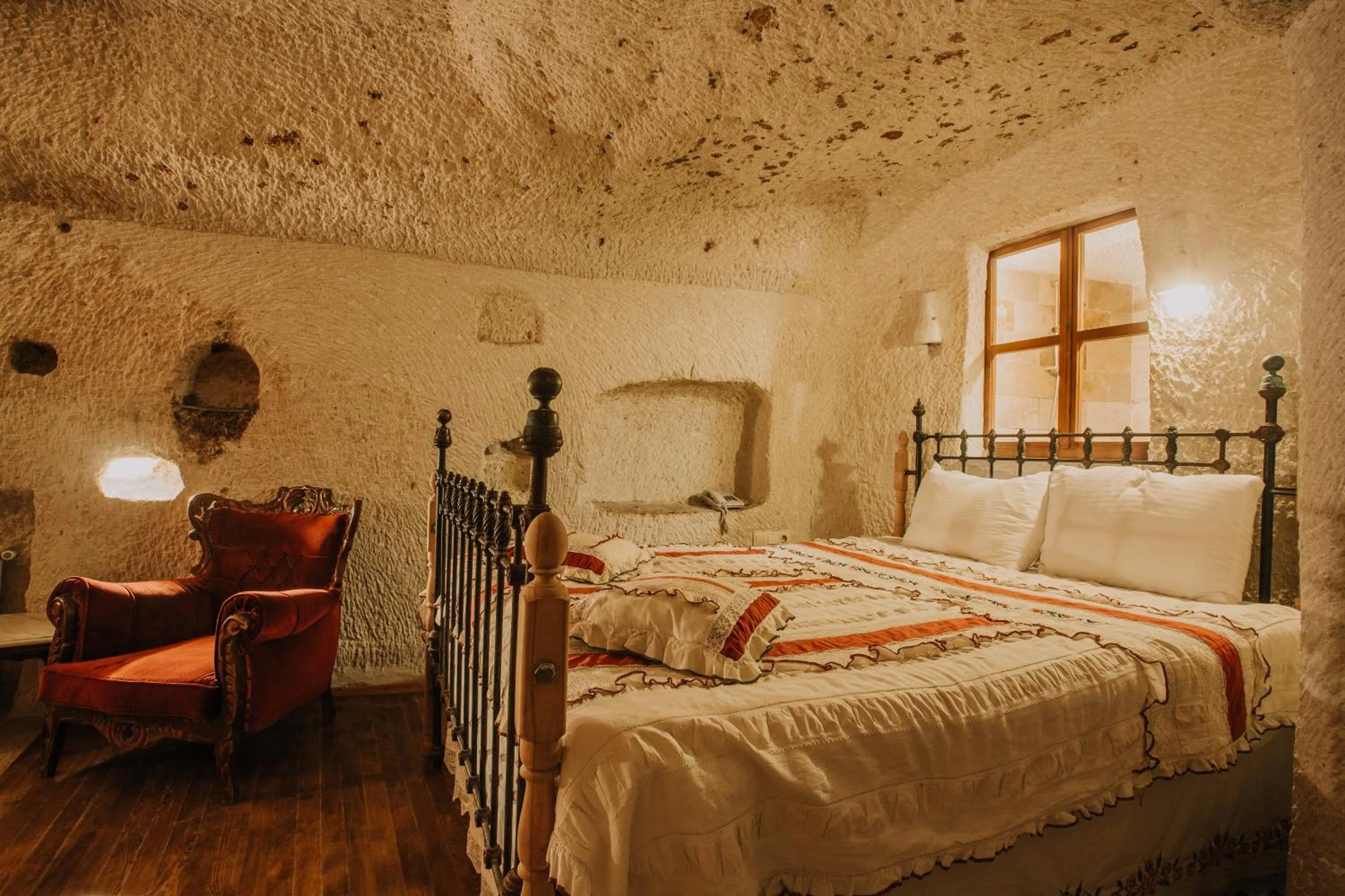 Bed in Village Cave House Hotel