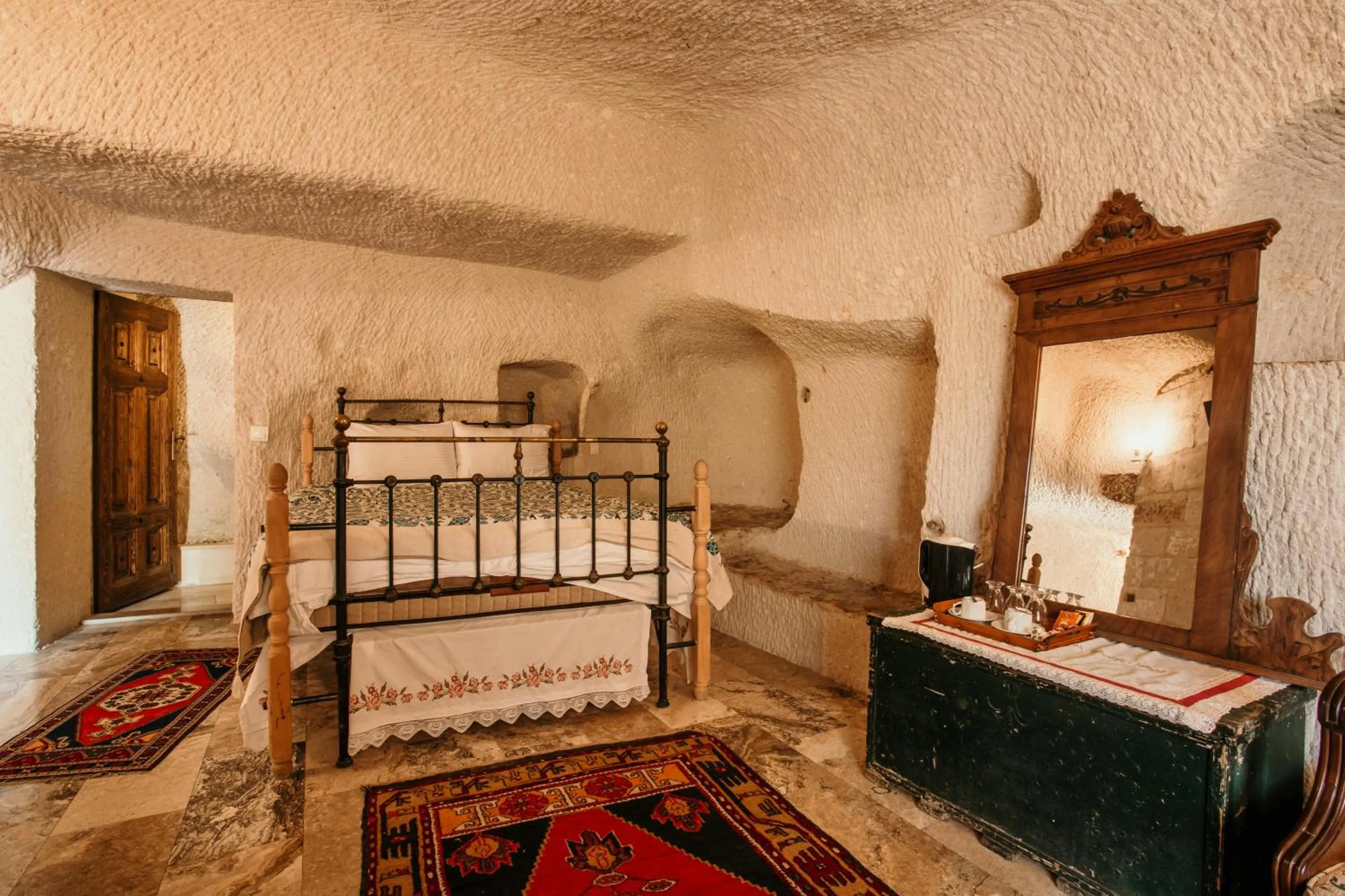 Bed in Village Cave House Hotel