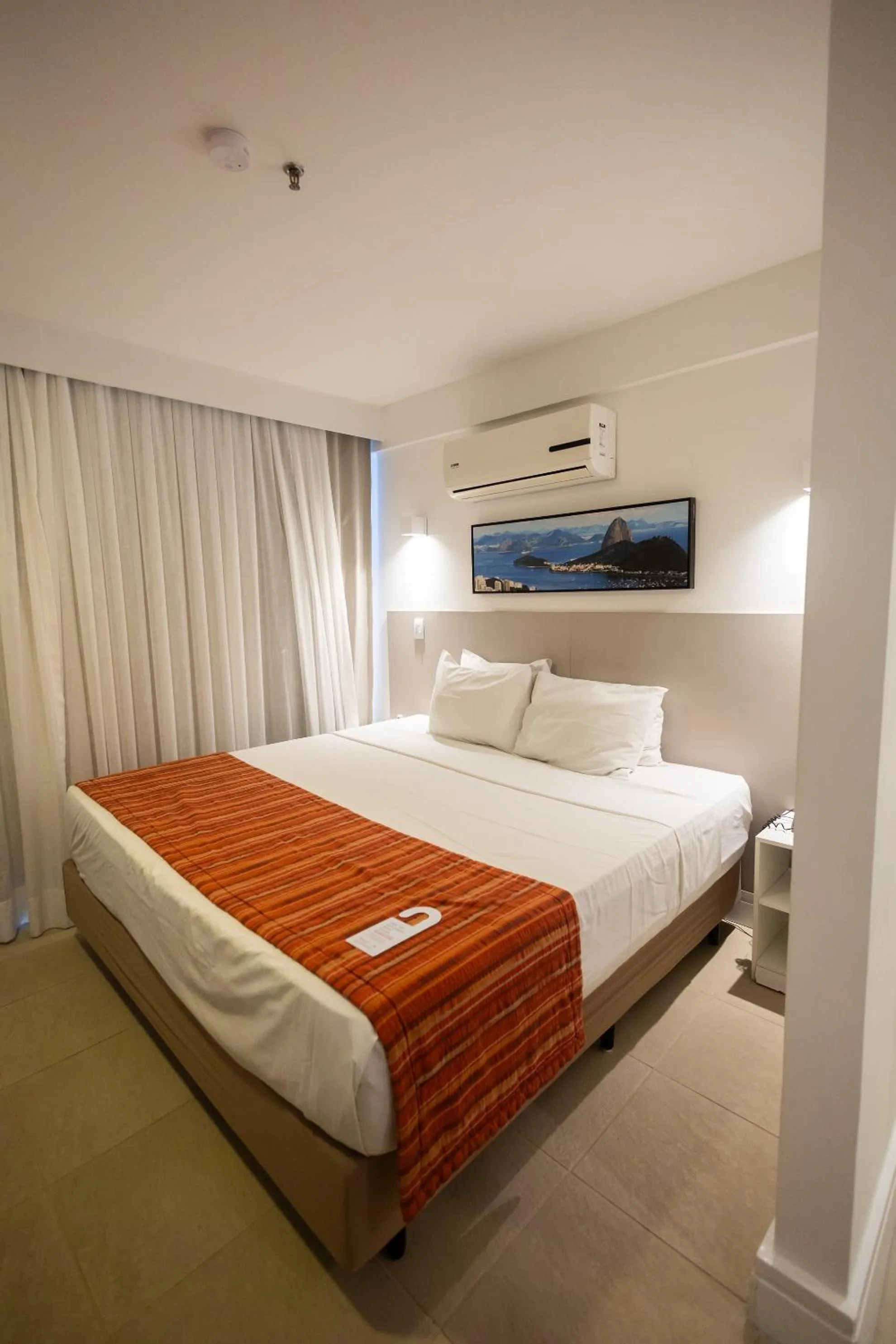 Bed in Ramada by Wyndham Macae Hotel & Suites