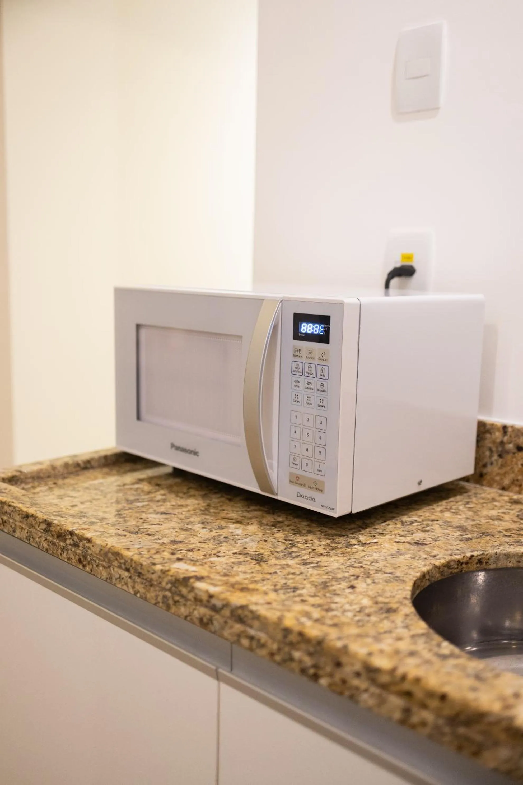 Kitchen or kitchenette in Ramada by Wyndham Macae Hotel & Suites