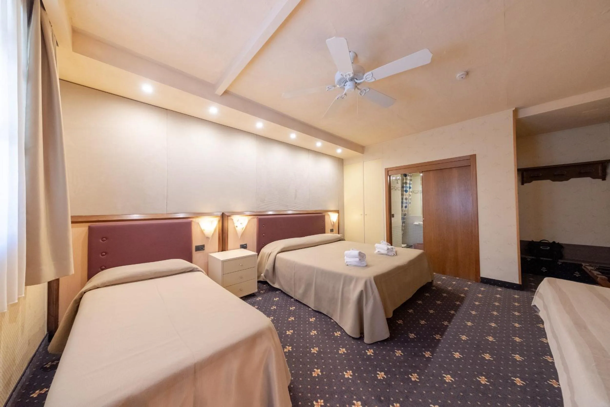 Bed in Holiday Rooms Antica Badia