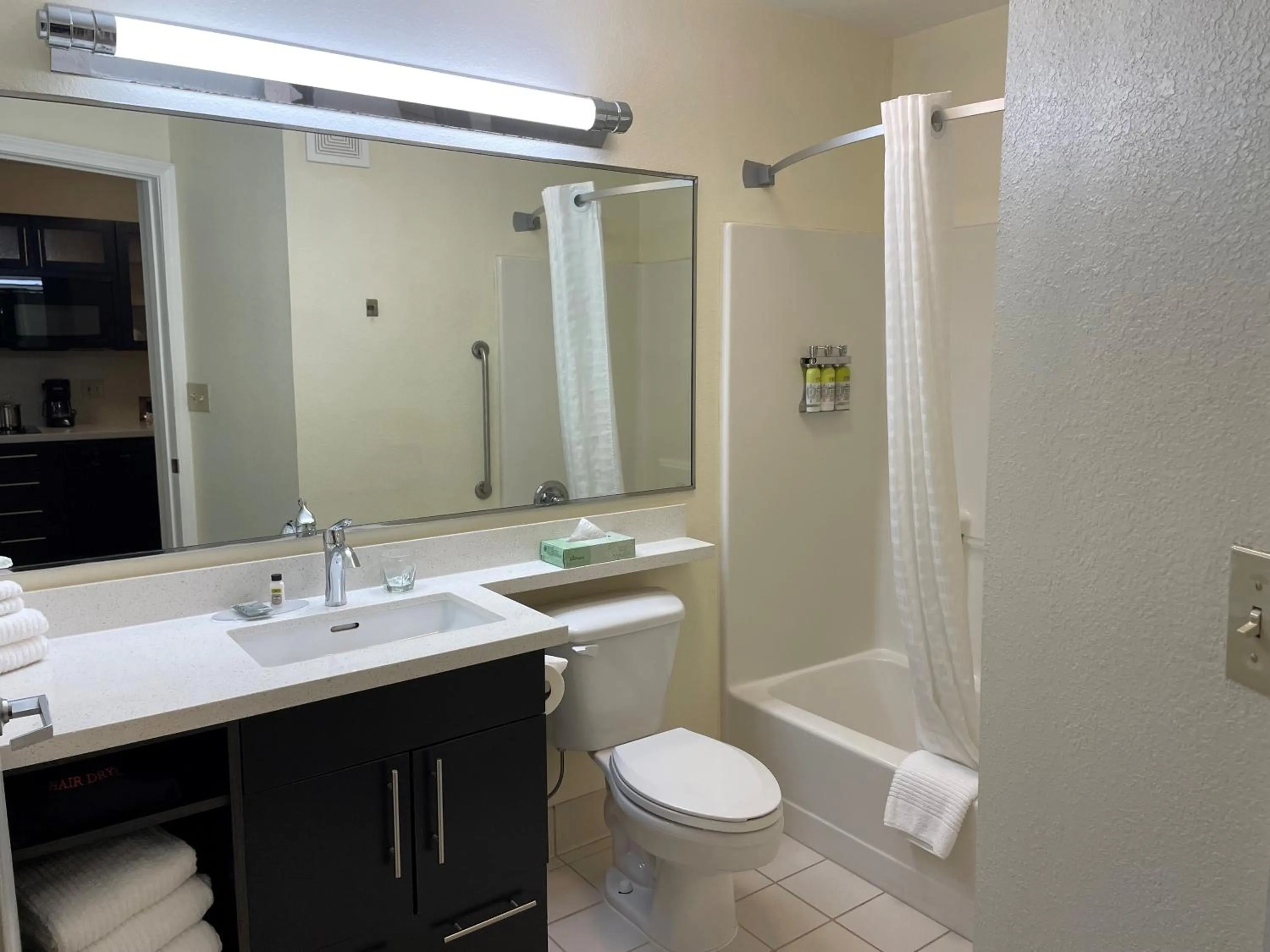 Bathroom in Candlewood Suites East Lansing by IHG