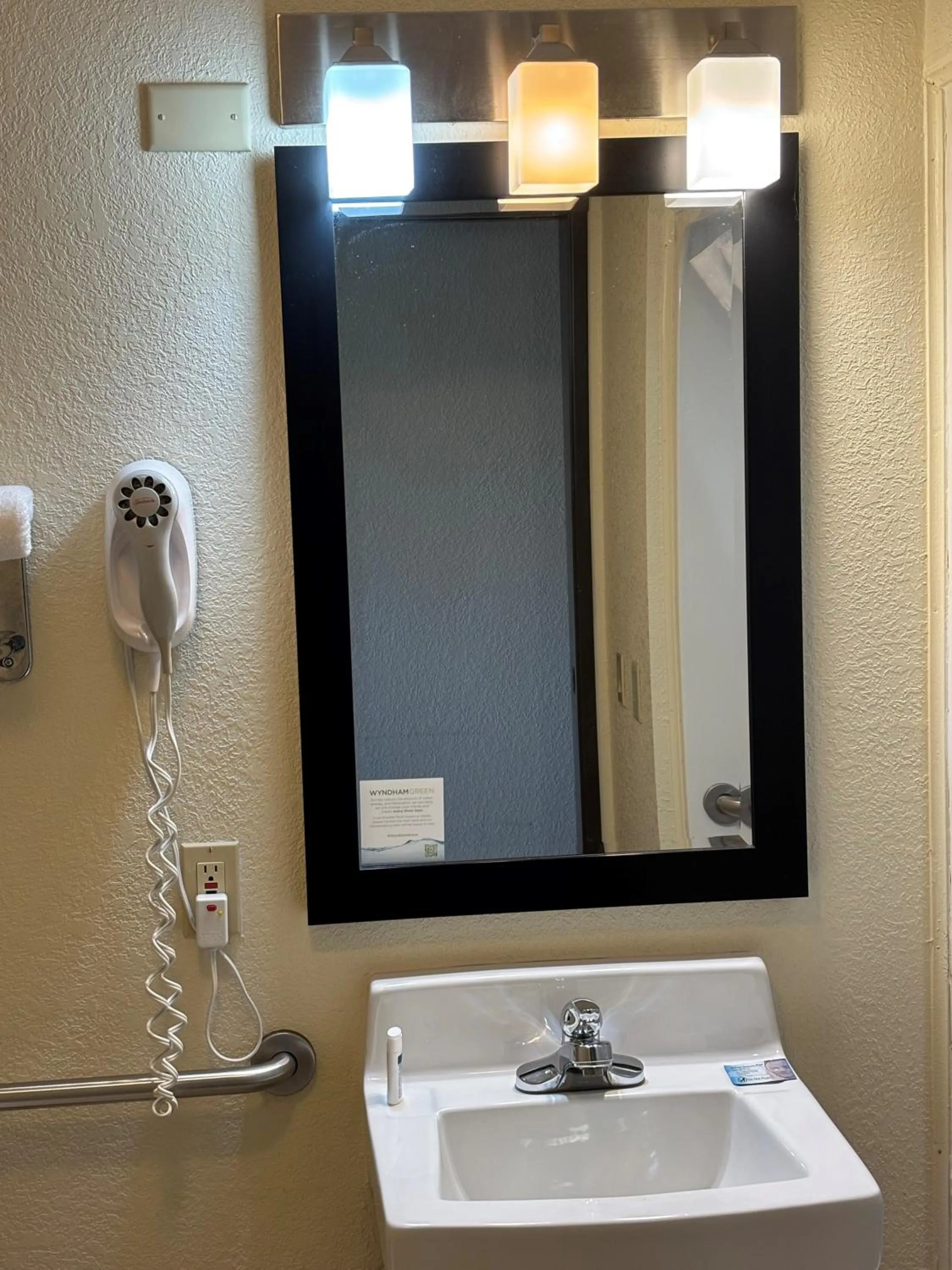 Bathroom in AmericInn by Wyndham Mount Pleasant