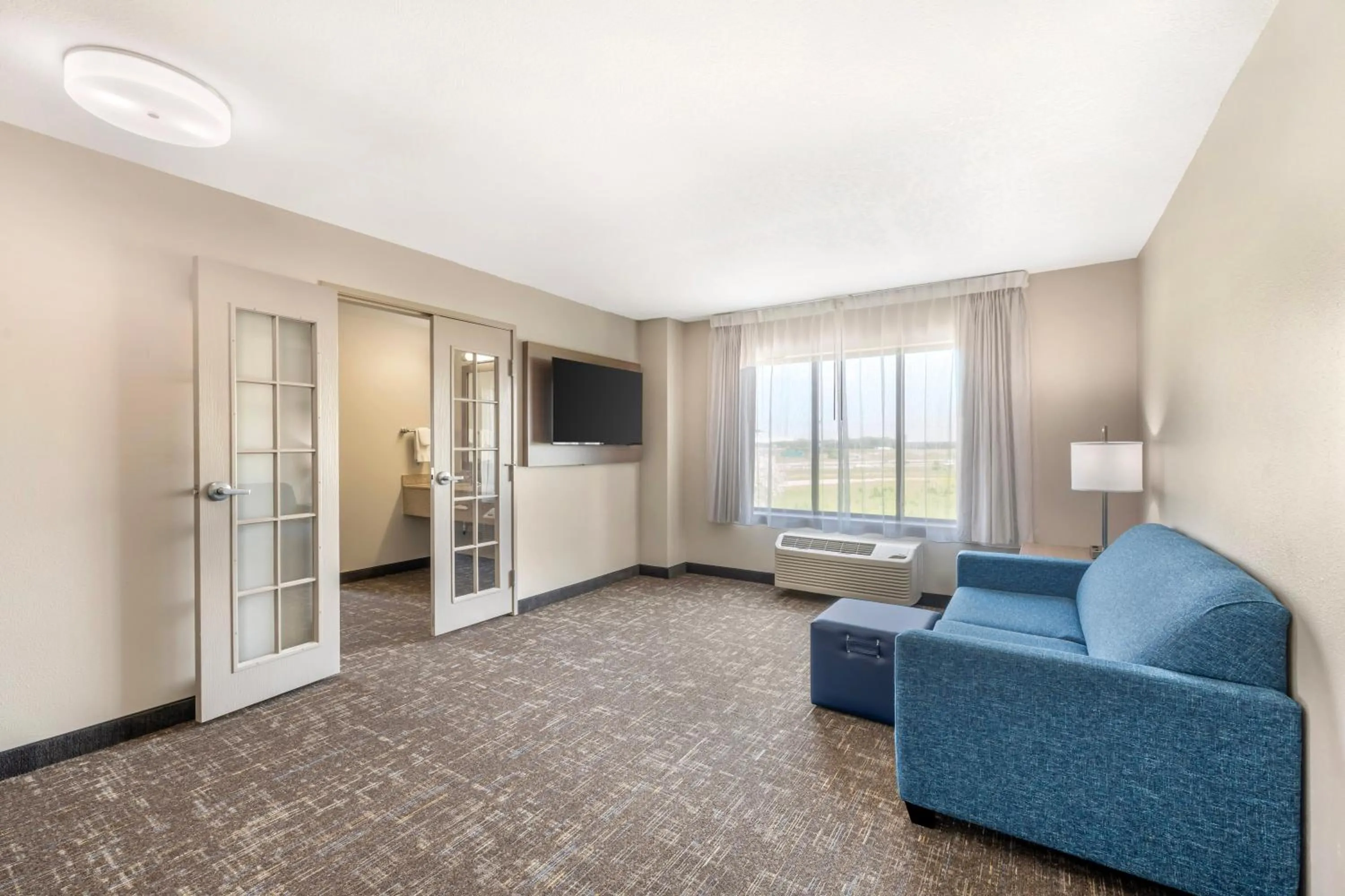 Seating area in Clarion Pointe Sioux Falls Airport