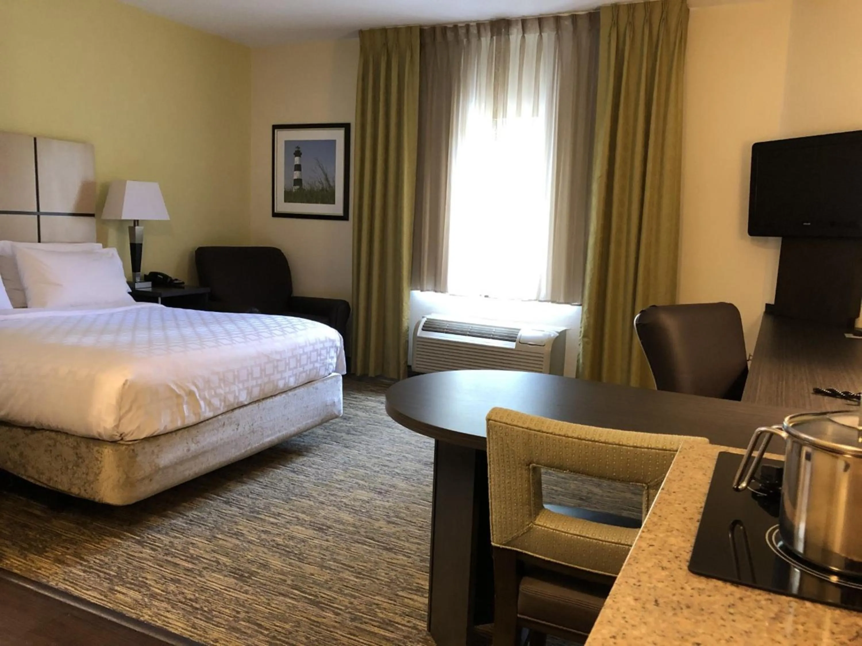 Photo of the whole room, Bed in Candlewood Suites Greenville NC by IHG