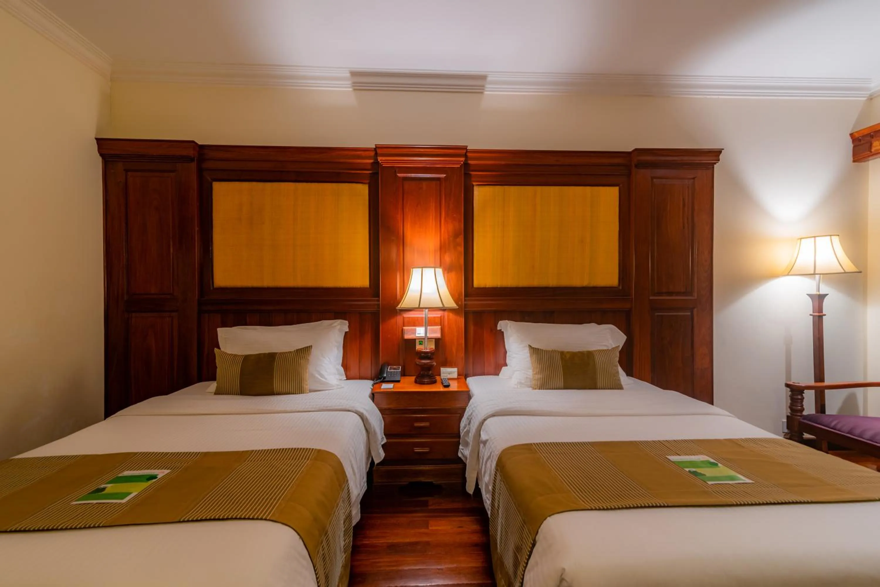 Bed in Empress Angkor Resort & Spa