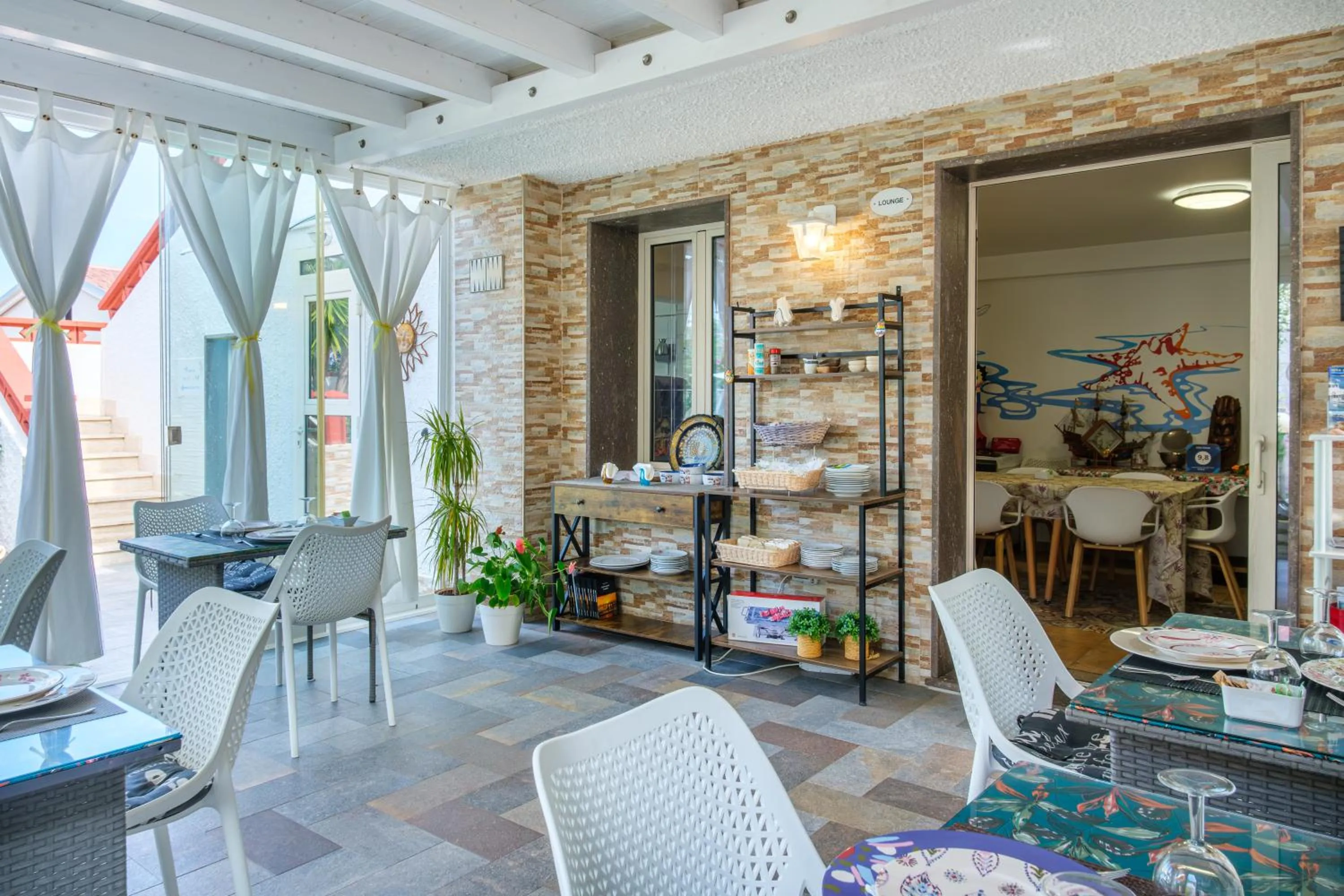 Communal lounge/ TV room in Villa Piana