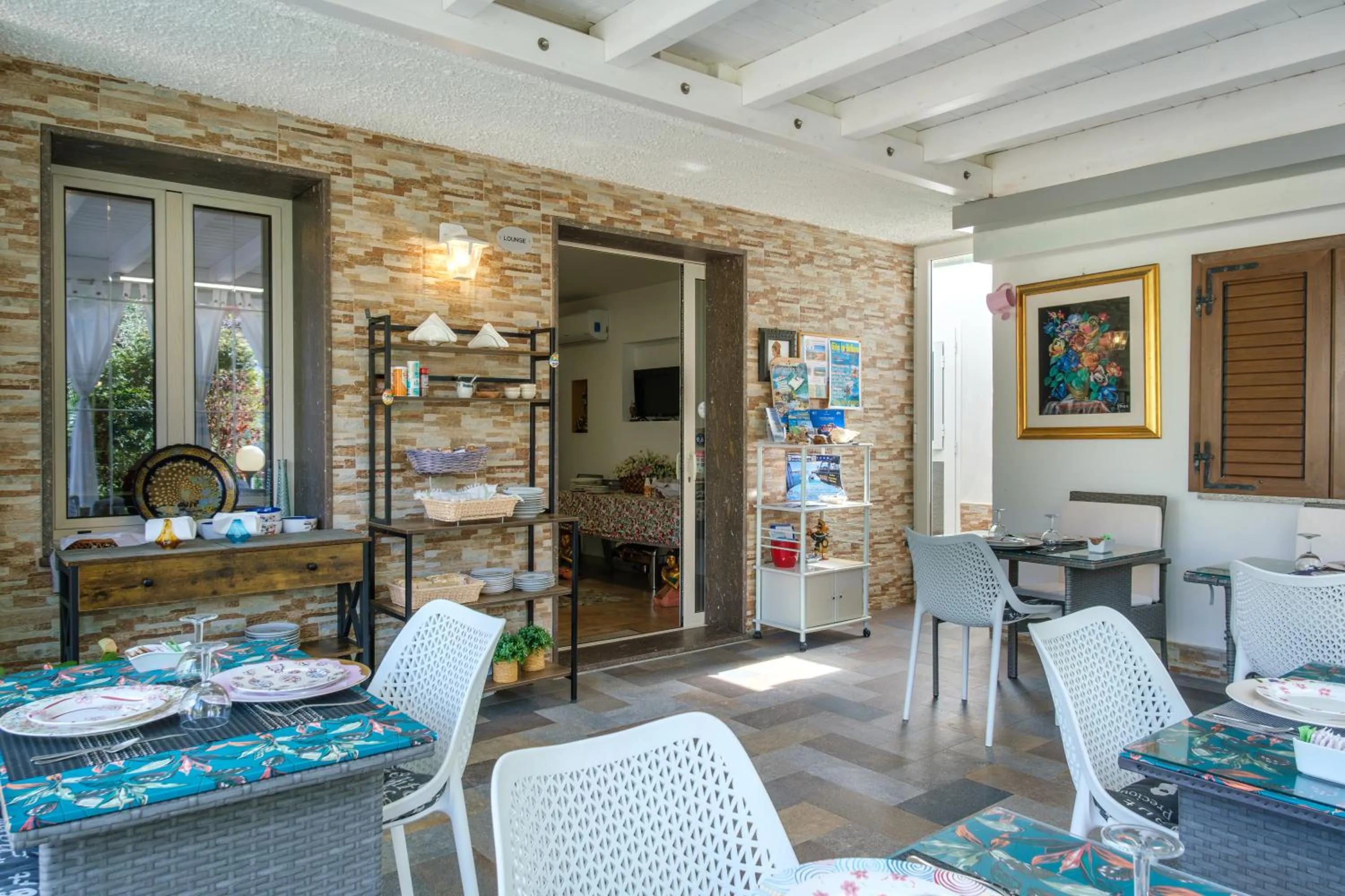 Communal lounge/ TV room in Villa Piana