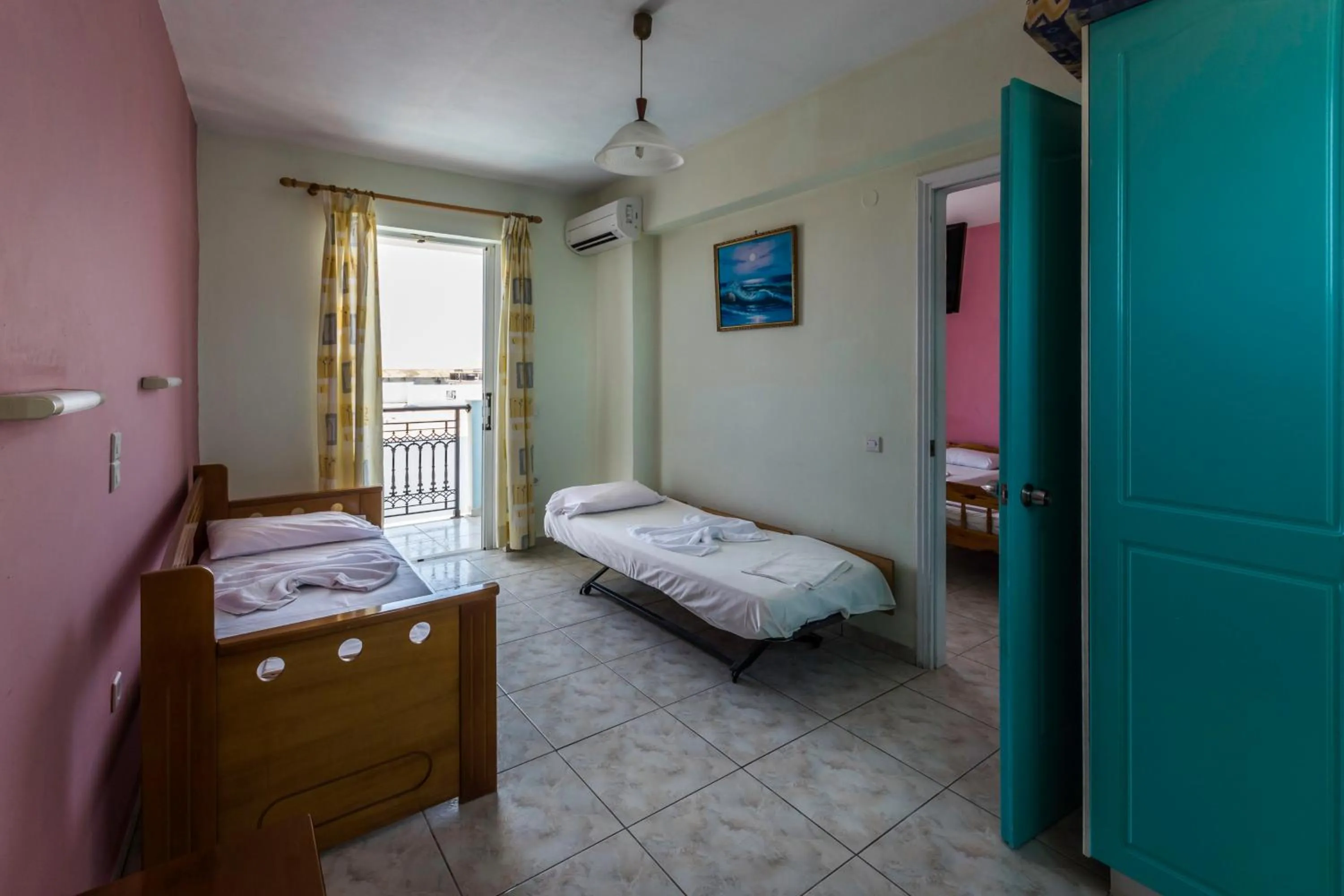 Bed in Vossos Hotel Apartments