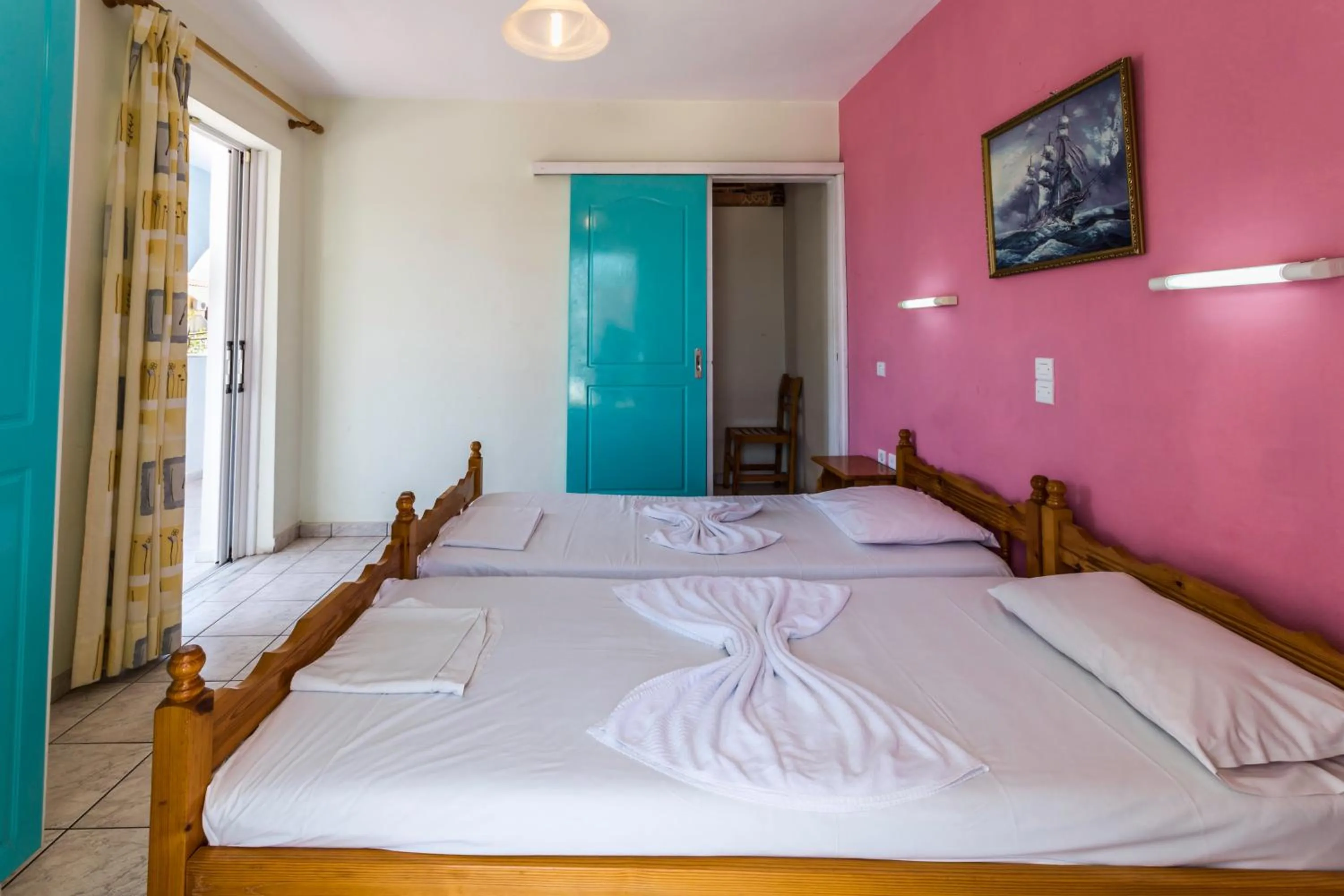 Bed in Vossos Hotel Apartments