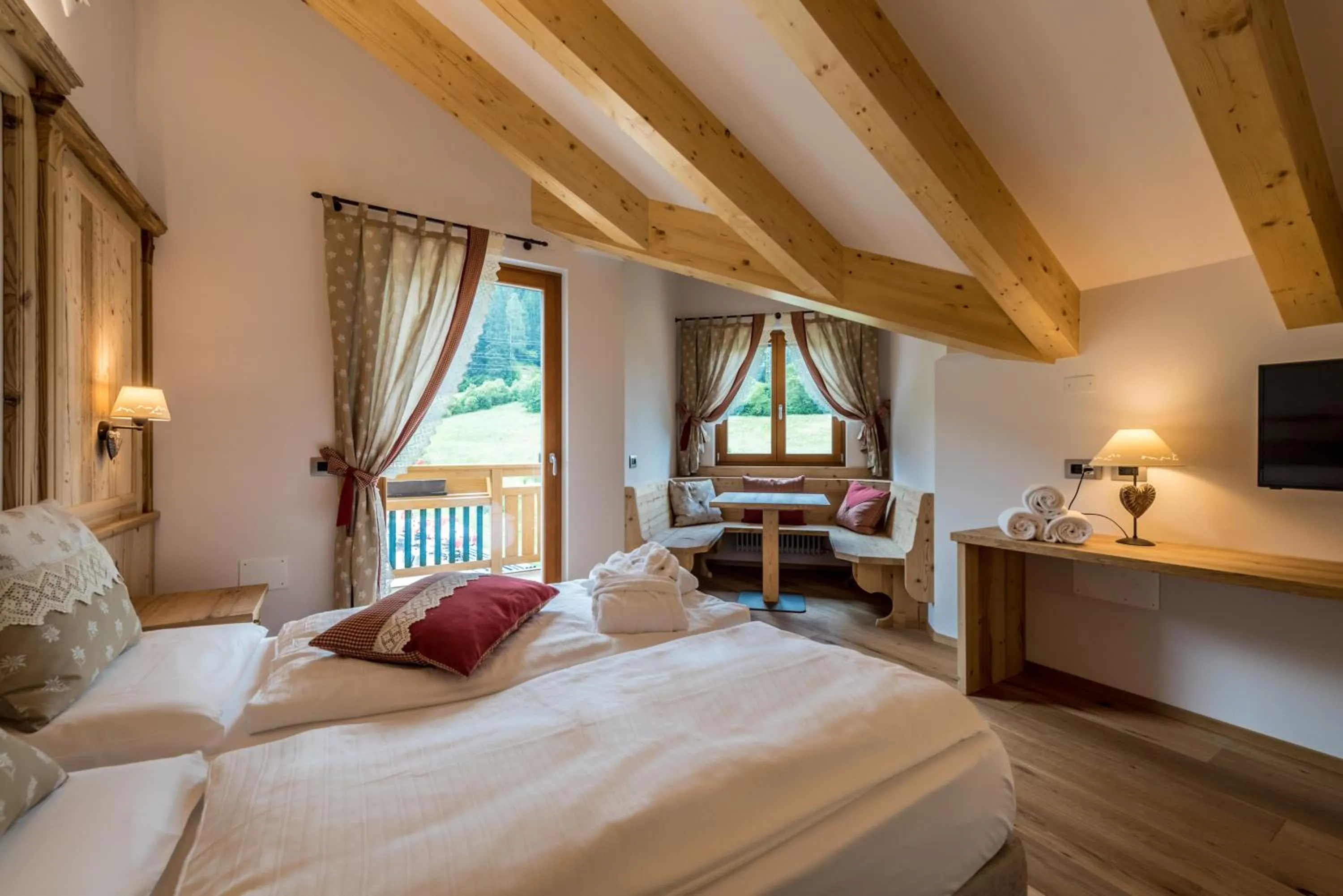 Bedroom, Bed in Tevini Dolomites Charming Hotel