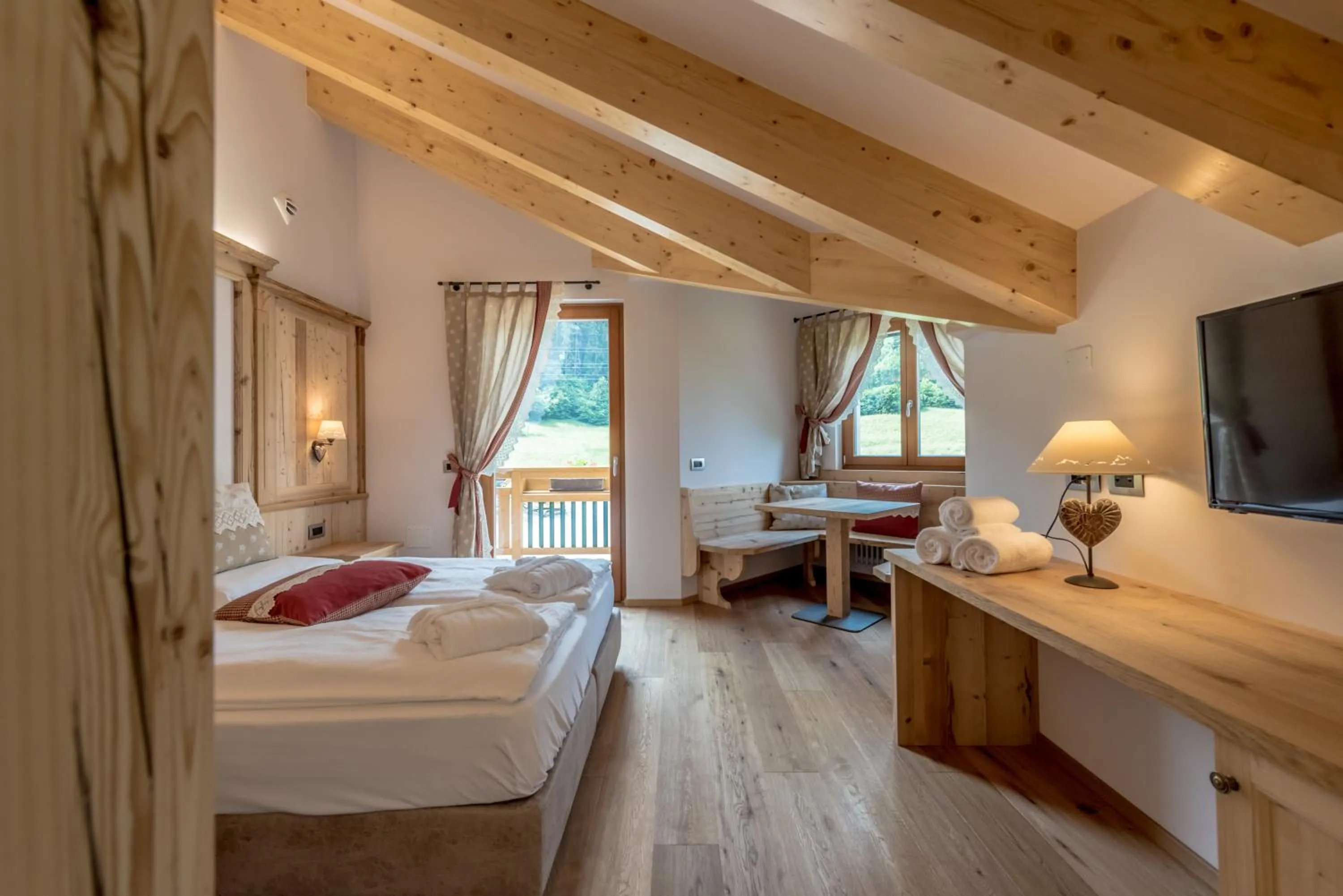 Photo of the whole room, Bed in Tevini Dolomites Charming Hotel