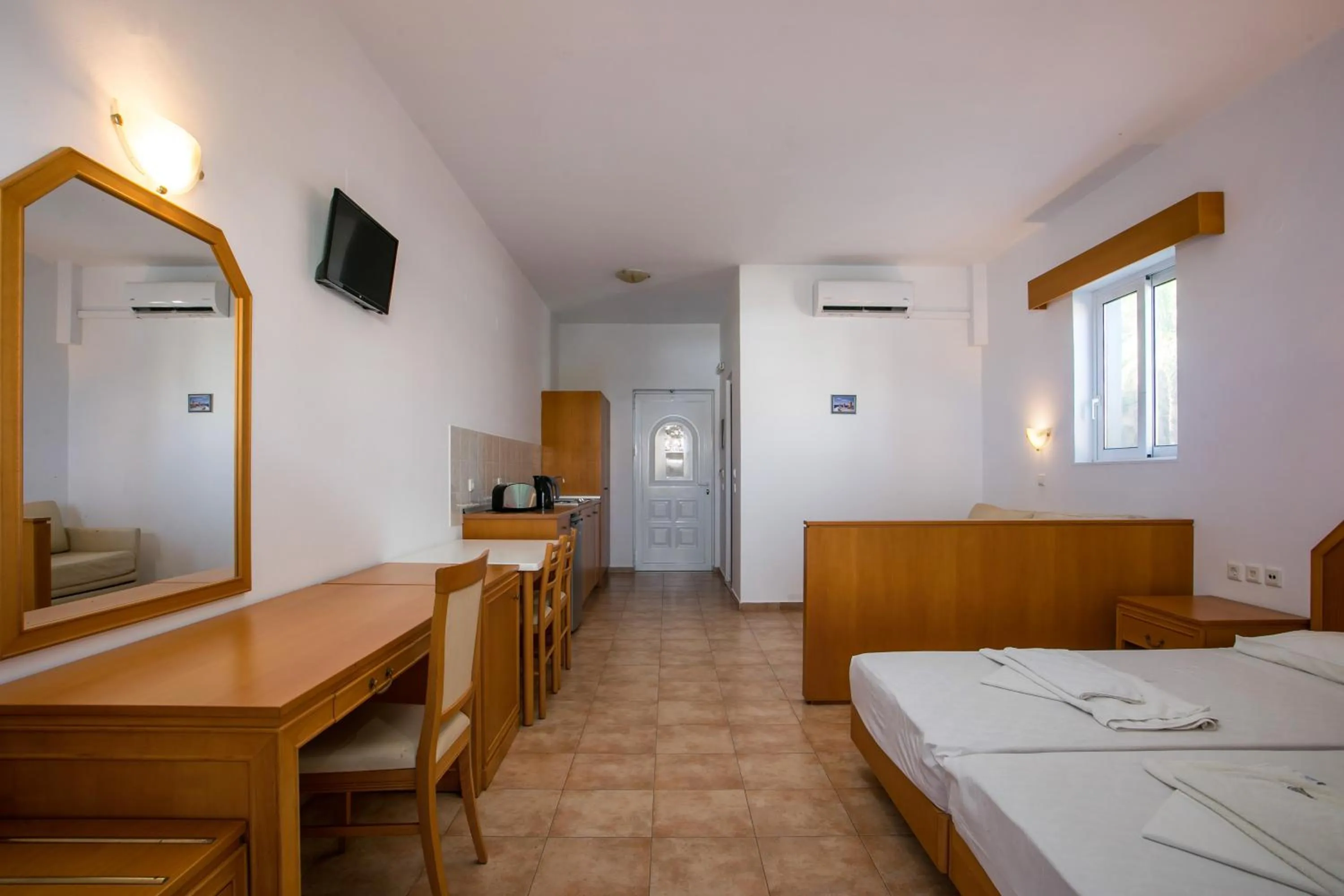 Bed in Lambis Studios & Apartments